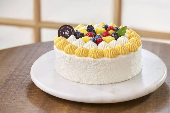 Order Tropical Mango Coconut Cake food online from Paris Baguette store, Mountain View on bringmethat.com