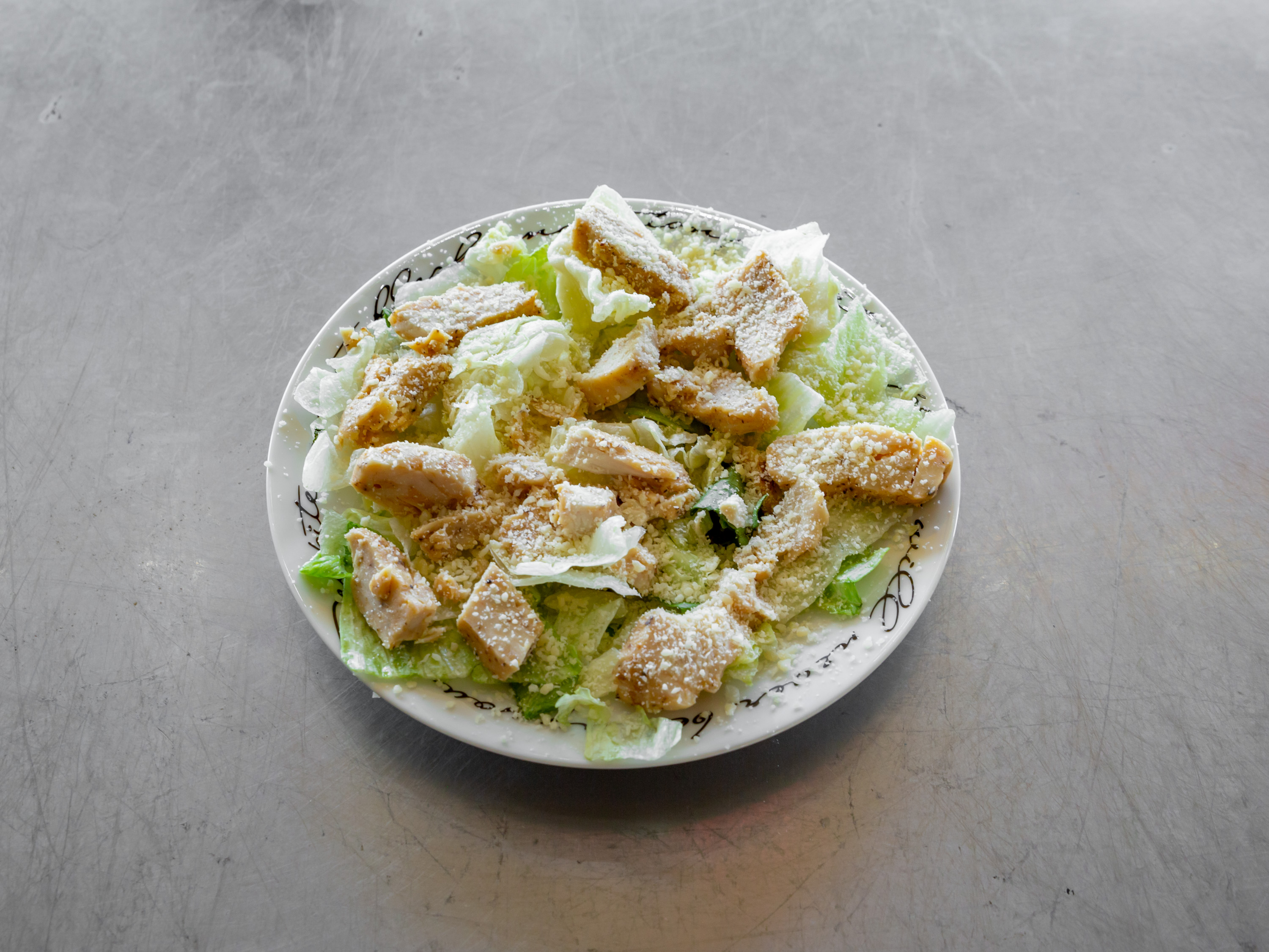 Order Chicken Caesar Salad food online from Roma - Pizza and Pasta store, Nashville on bringmethat.com