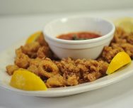 Order Fried Calamari food online from Basil Leaf Cafe store, Chicago on bringmethat.com