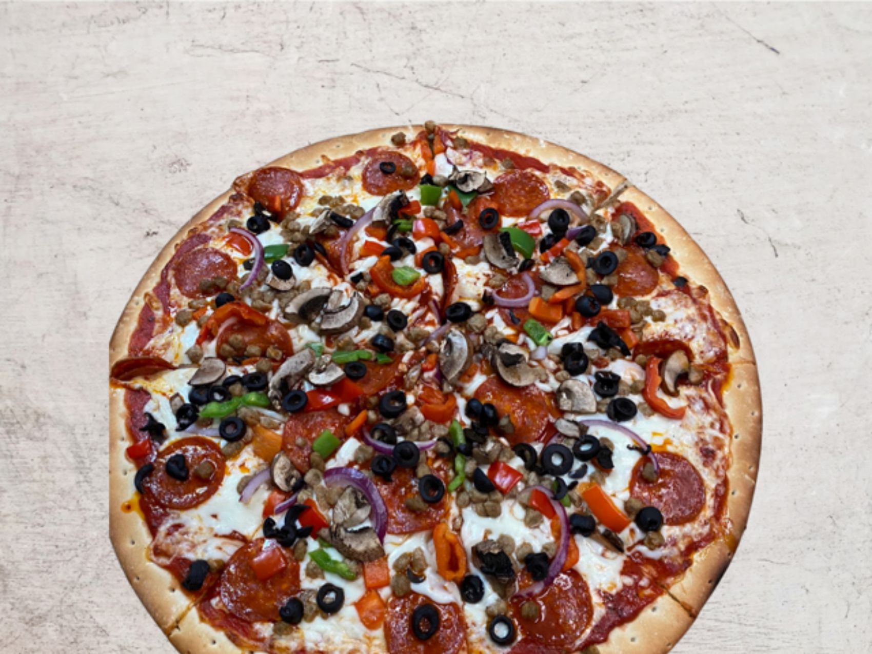 Order Deluxe Pizza* food online from The Slice Pizzeria store, San Antonio on bringmethat.com
