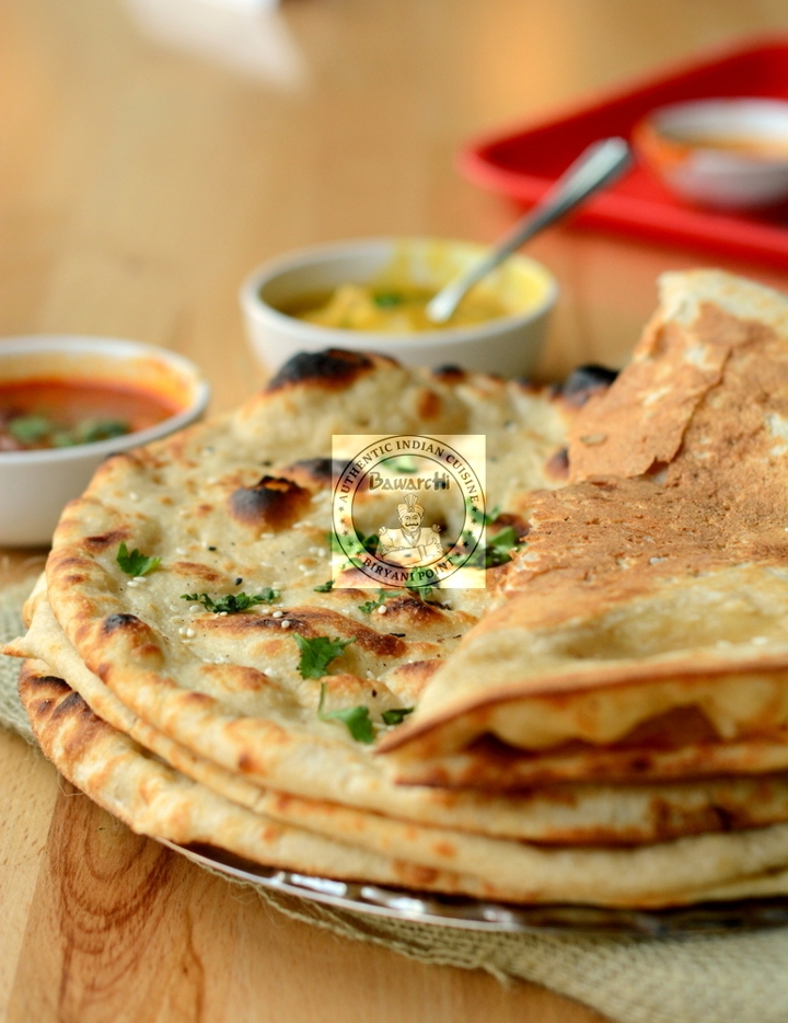Order Garlic Naan food online from Bawarchi Biryanis store, Ashburn on bringmethat.com