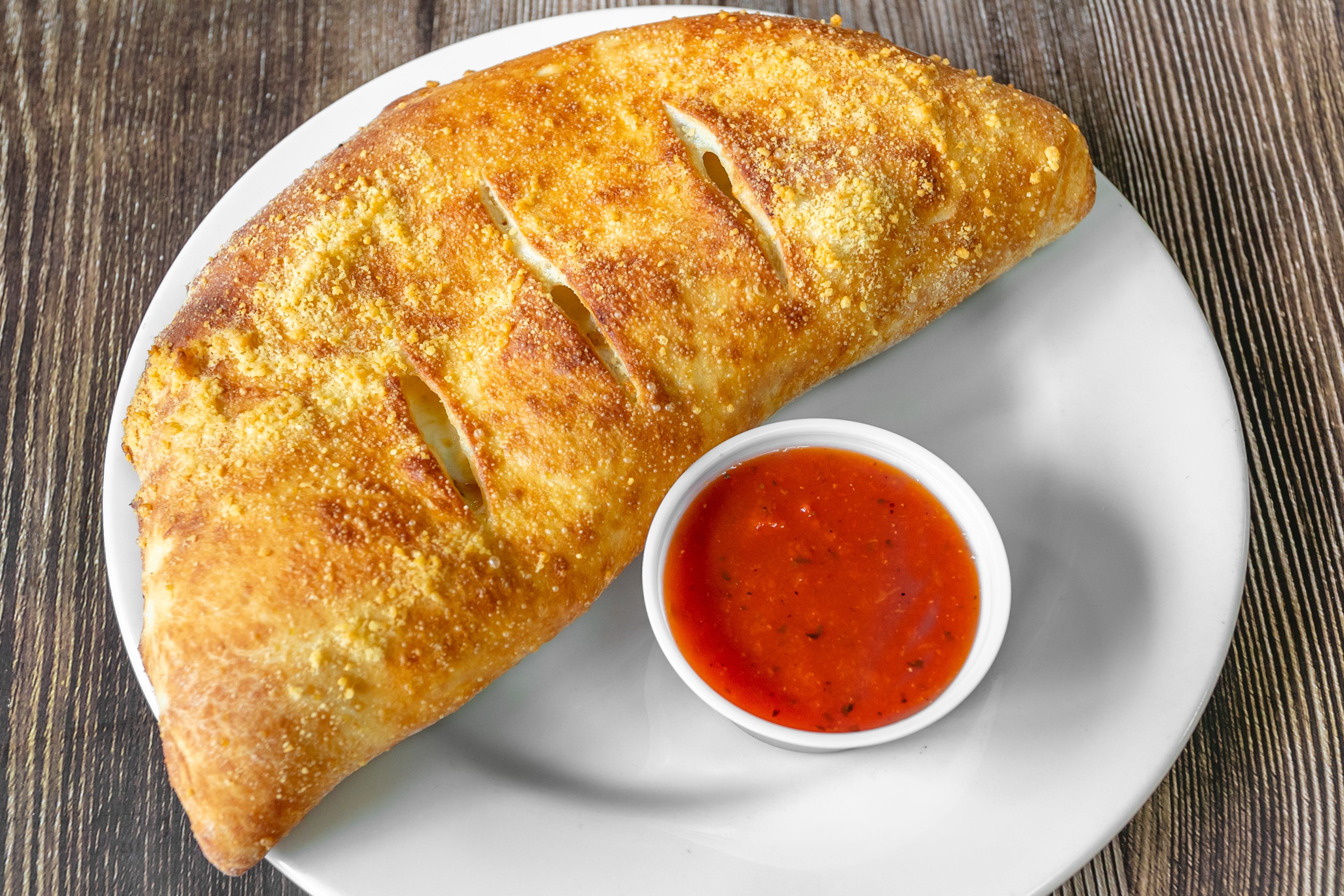 Order Three Cheese Calzone - Small 10" food online from Bulldawgs Pizza store, Athens on bringmethat.com