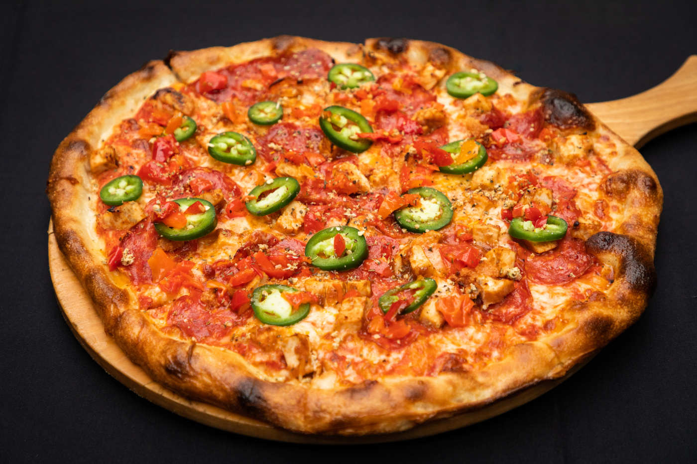 Order Spicy Pizza food online from Wells Street Pizza store, Chicago on bringmethat.com