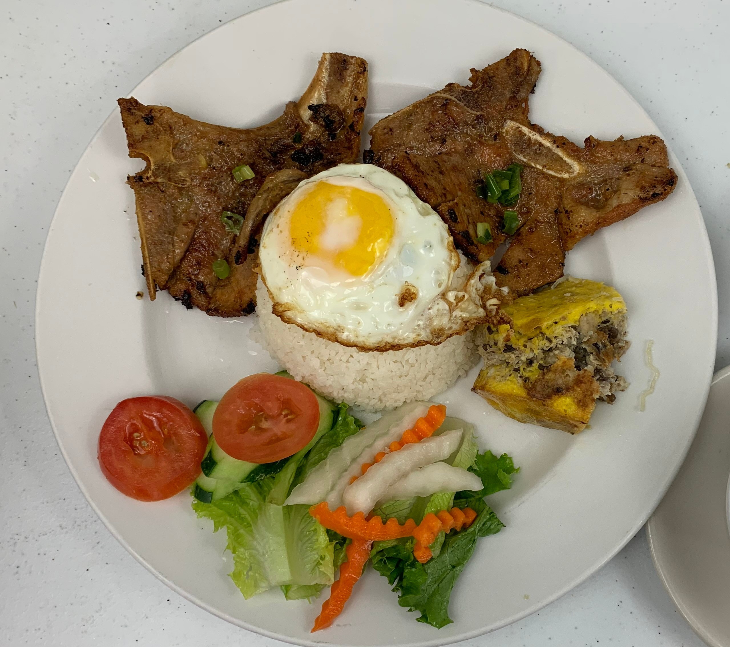 Order Com Dac Biet - Rice with Grilled Pork Chop, Egg, and Egg Cake food online from Joyful House store, Saint Louis on bringmethat.com