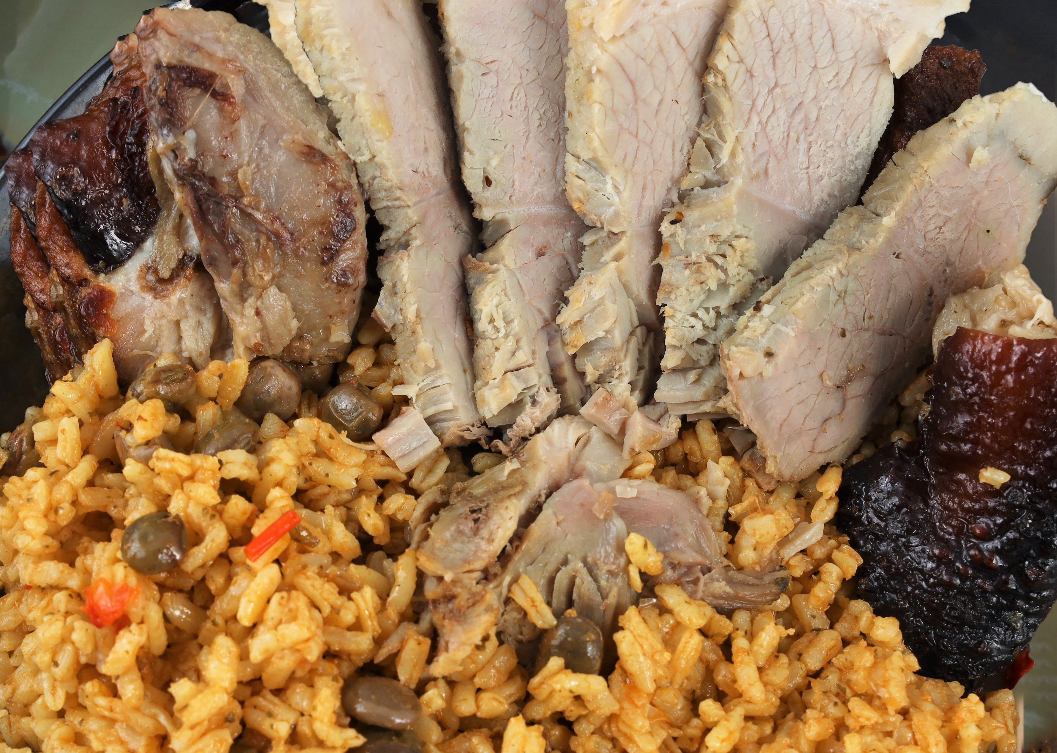 Order Puerto Rican Style Oven roasted Pork shoulder " Pernil" Combo  food online from Maru Kitchen store, Citrus Heights on bringmethat.com