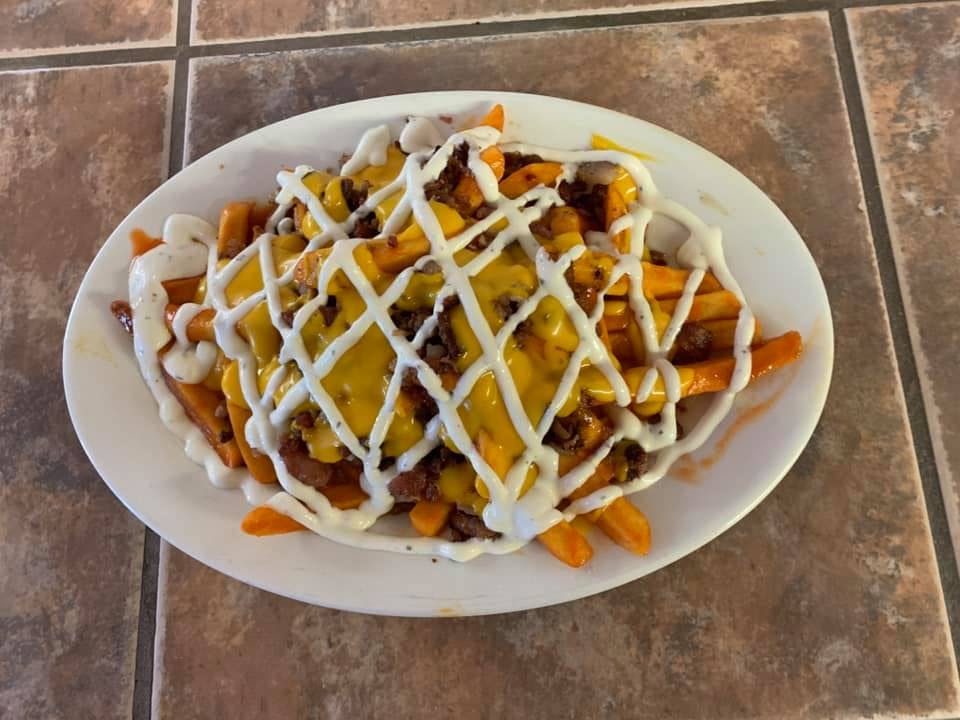 Order French Fries with Cheese & Bacon - Appetizer food online from Brother's Pizza store, York on bringmethat.com