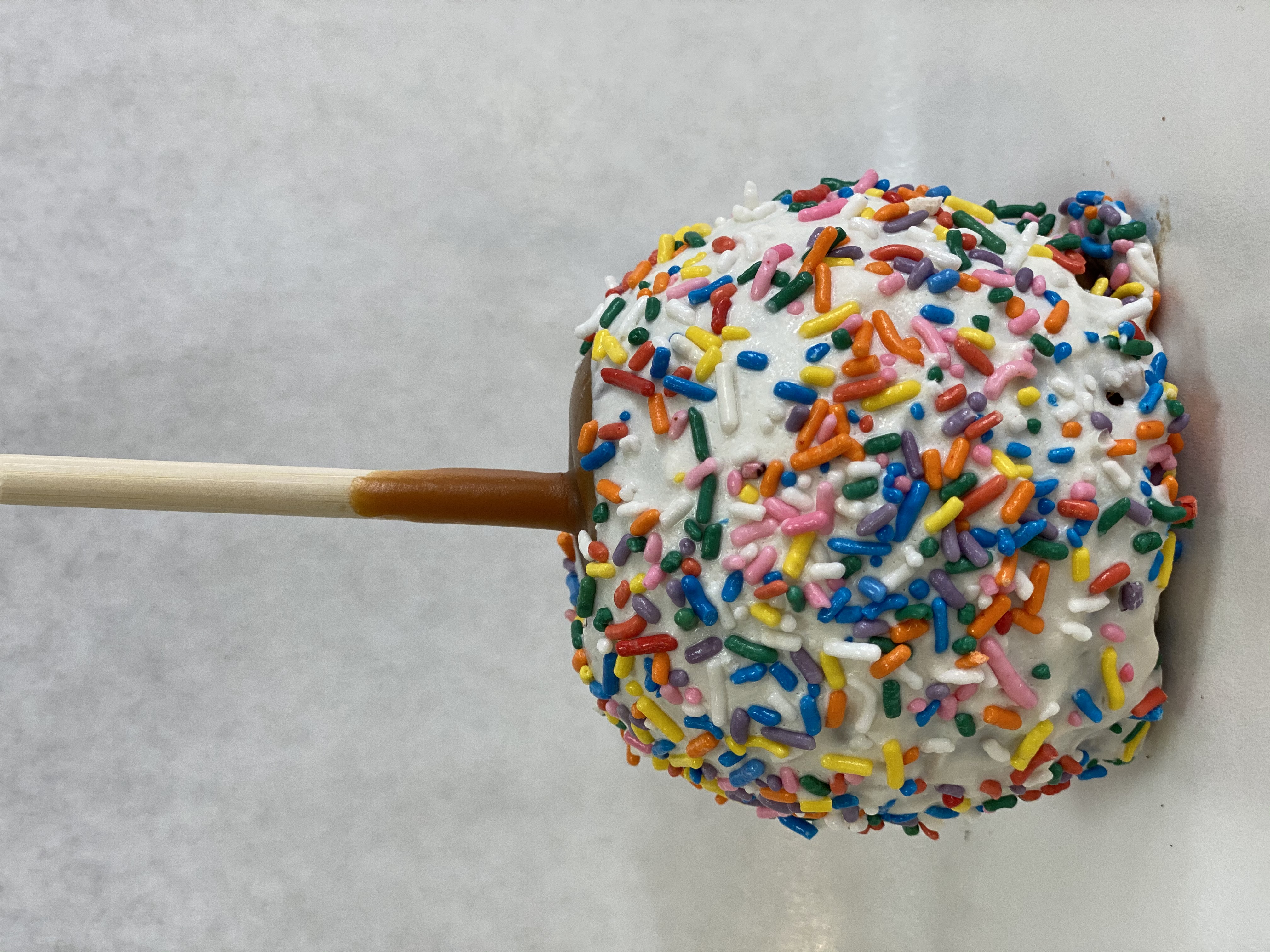 Order Sprinkles Caramel Apple food online from Rocky Mountain Chocolate Factory store, Irvine on bringmethat.com