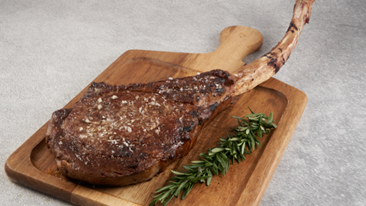 Order Prime Tomahawk Ribeye* 32 oz food online from The Palm/Swissotel Chicago store, Chicago on bringmethat.com