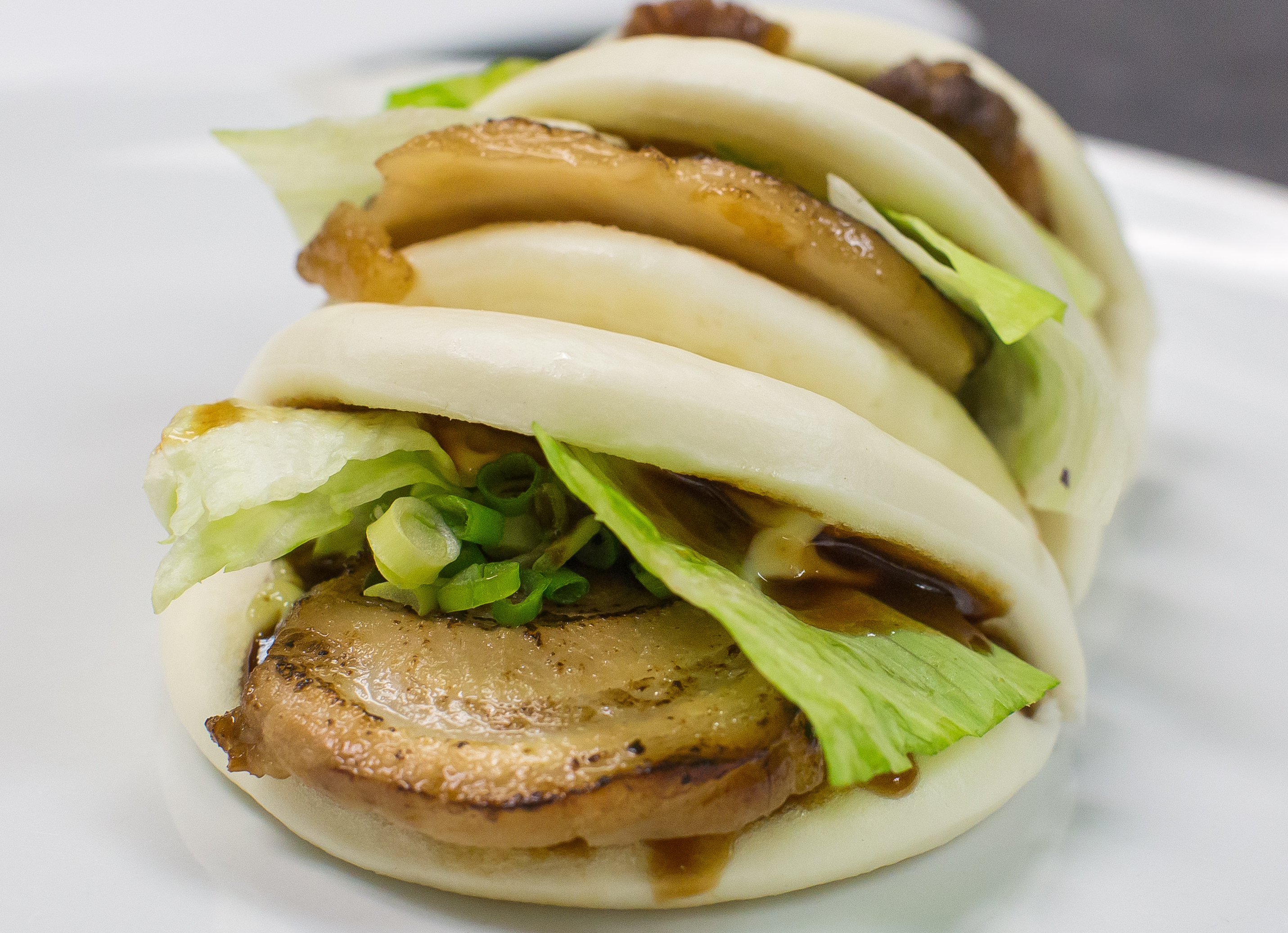 Order Steamed Buns with BBQ Pork Belly food online from Wild Sushi And Ramen store, Fort Worth on bringmethat.com