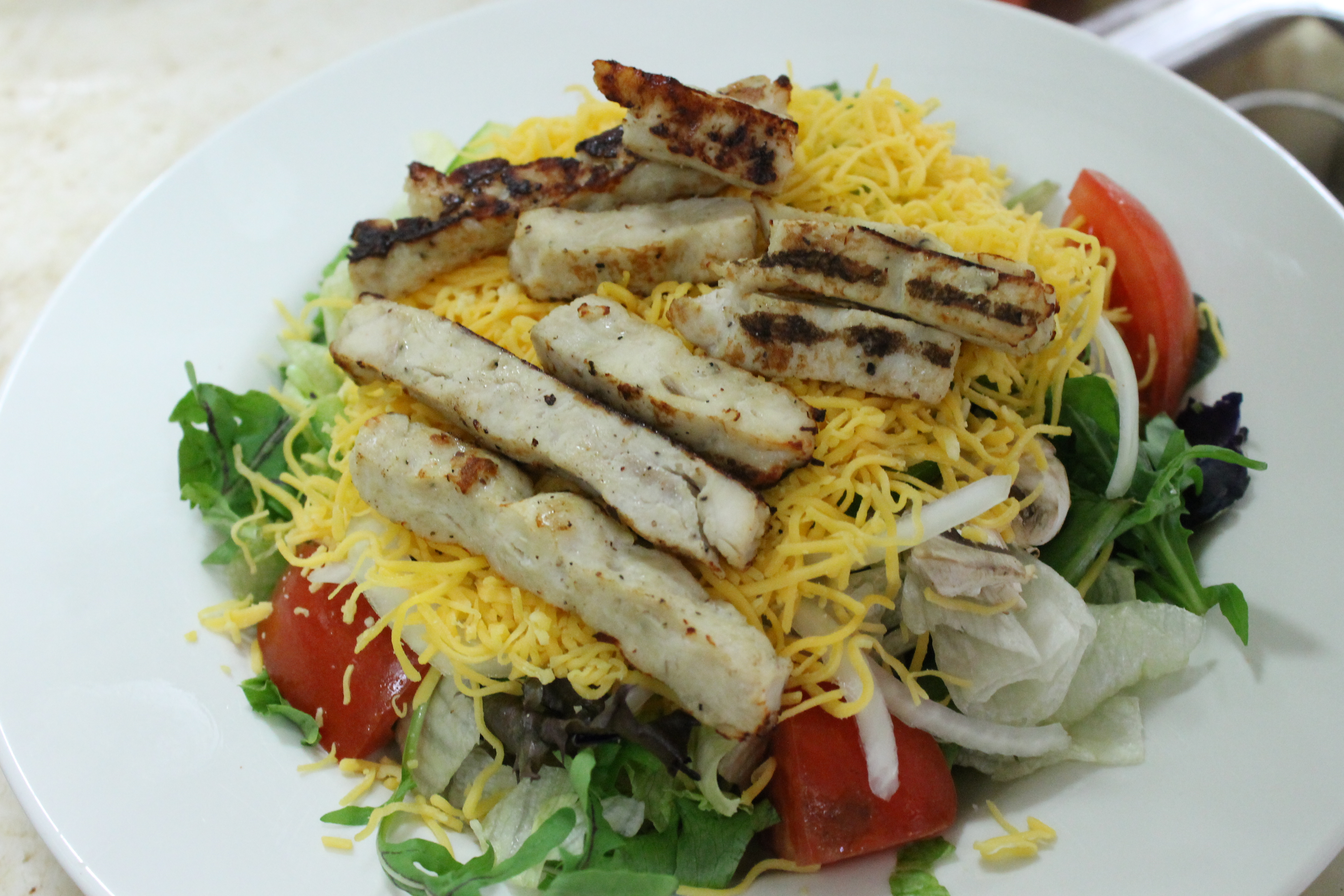 Order Grilled Chicken Salad food online from Bellacino Pizza & Grinders store, Farmington on bringmethat.com