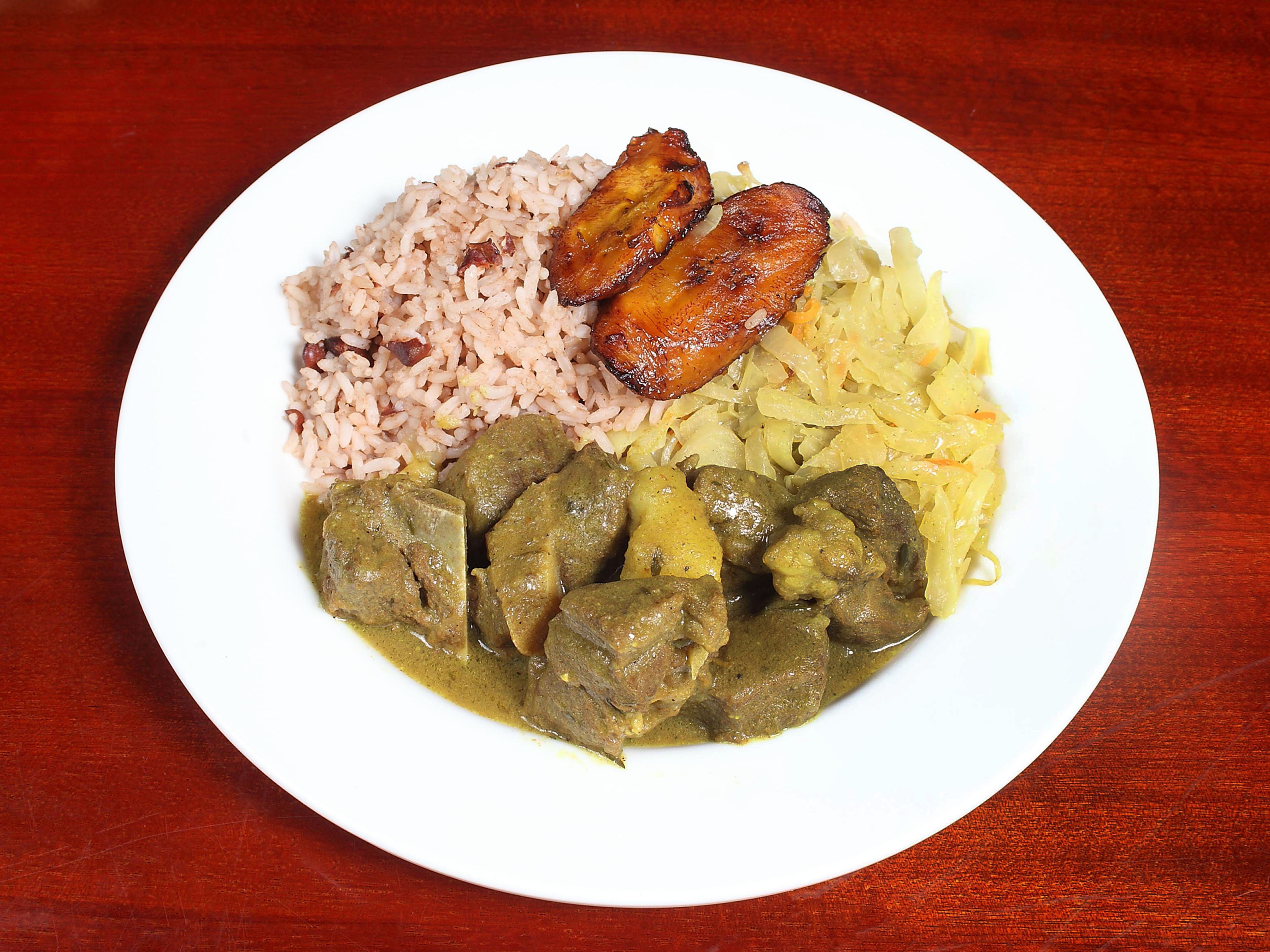 Order Curried Goat food online from Island Cuisine store, Charlotte on bringmethat.com