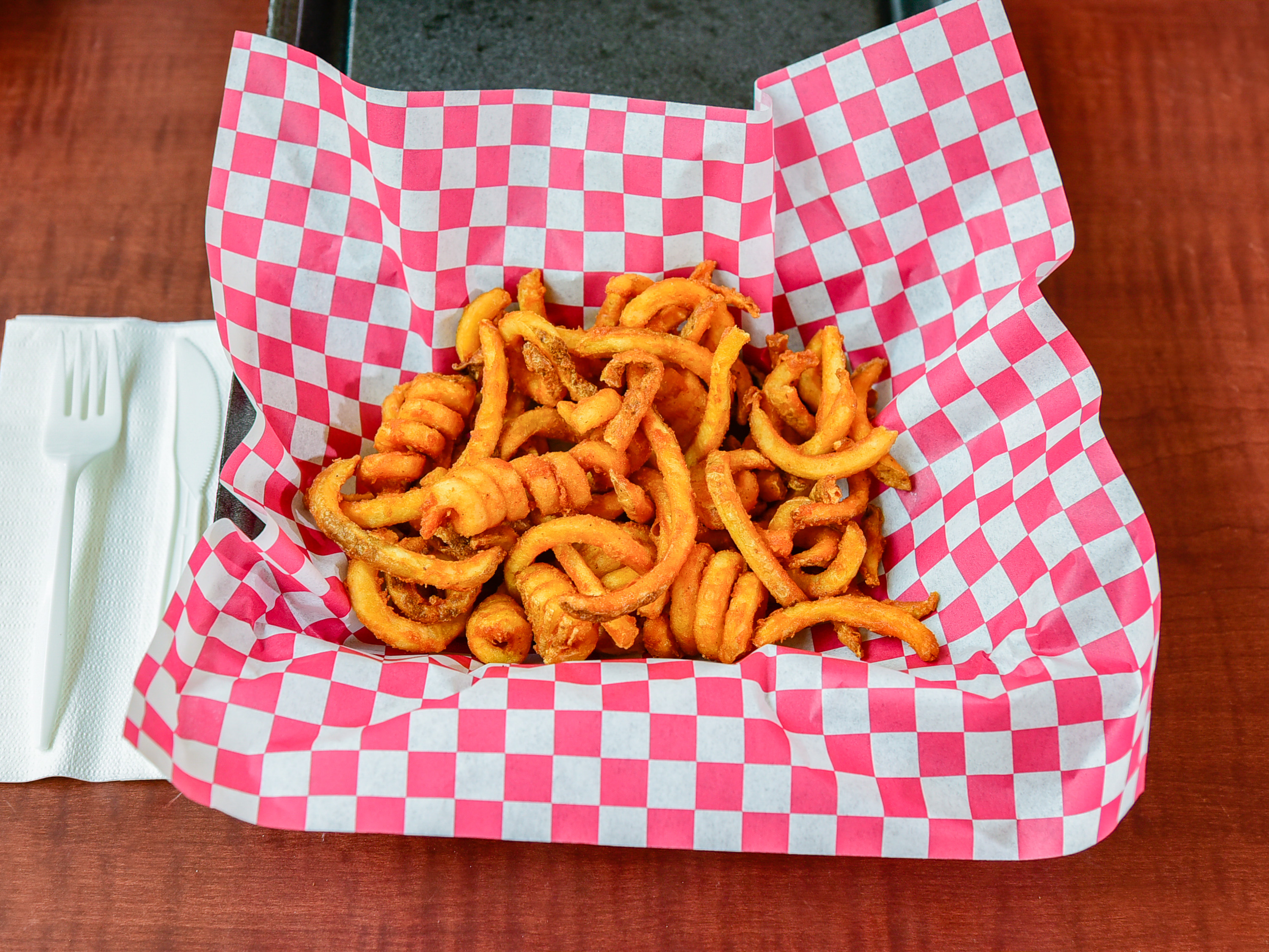 Order Seasoned Curly Fries food online from Great Steakout store, Rochester on bringmethat.com