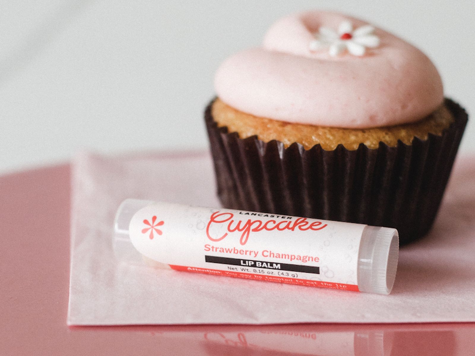 Order Lip Balm - Strawberry Champagne food online from Lancaster Cupcake store, Lancaster on bringmethat.com