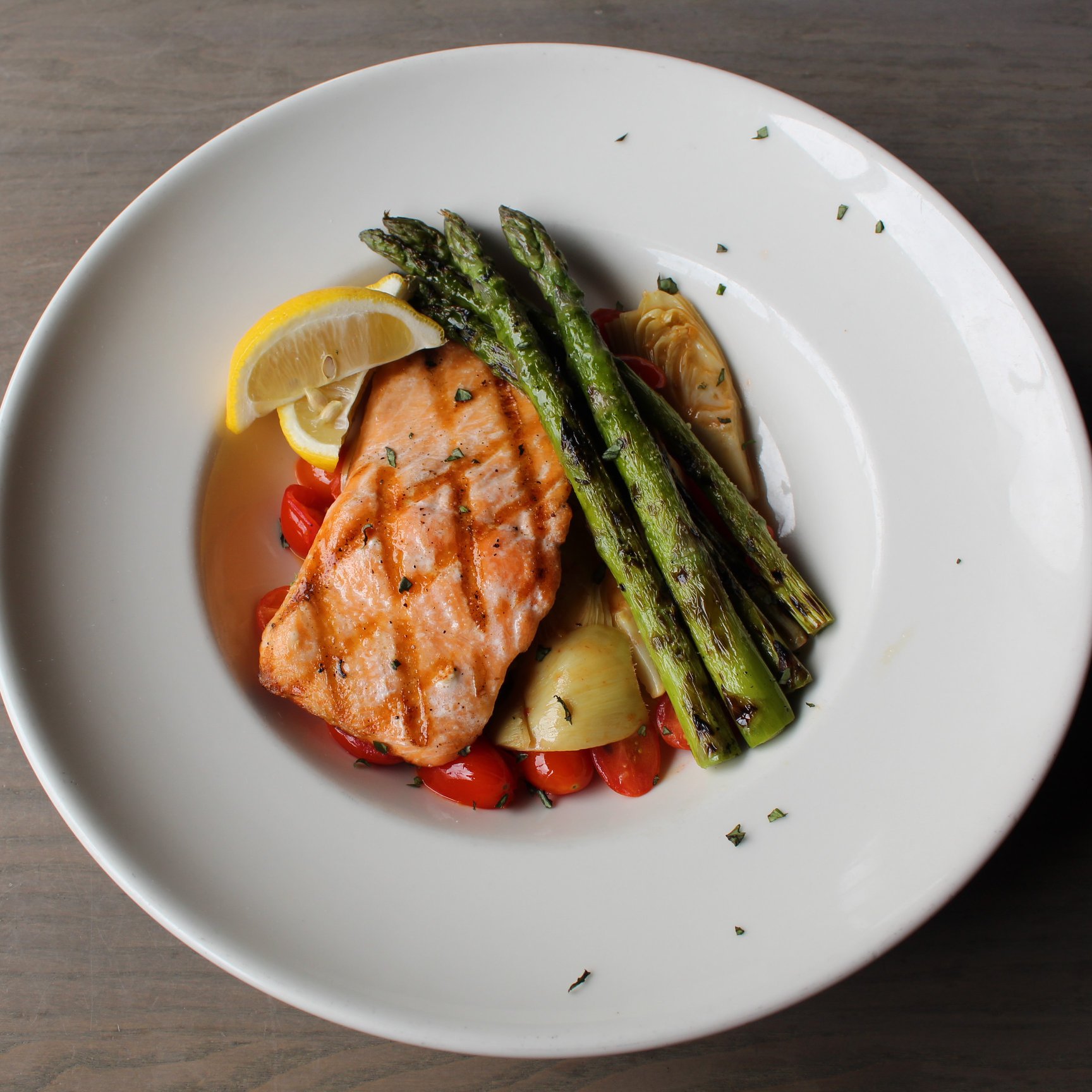 Order Grilled Salmon and ​Artichoke Compote food online from Uccello's store, Grand Rapids on bringmethat.com