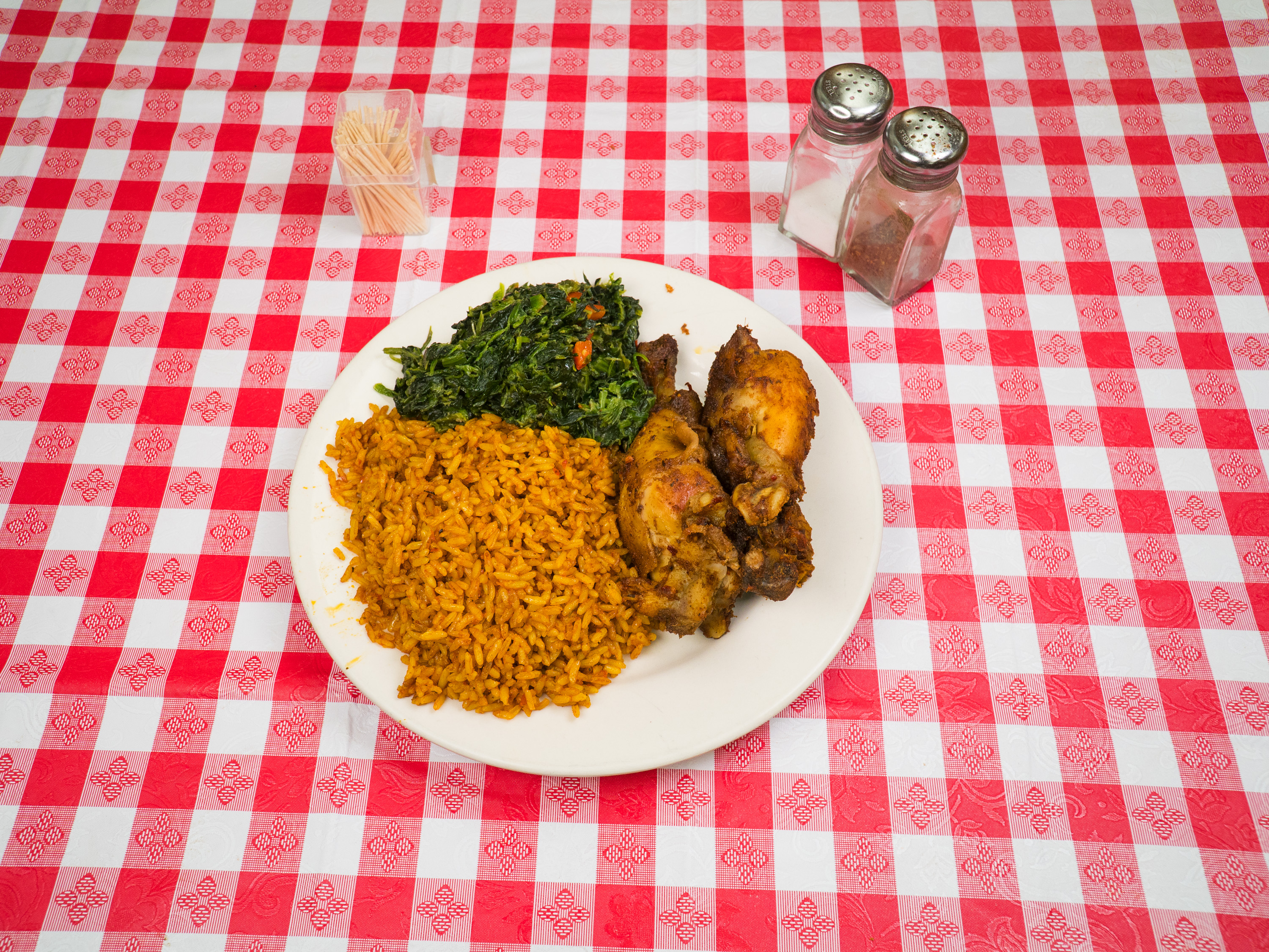 Order Jollof Rice with Spinach food online from Jodeem African Cuisine store, Greenbelt on bringmethat.com