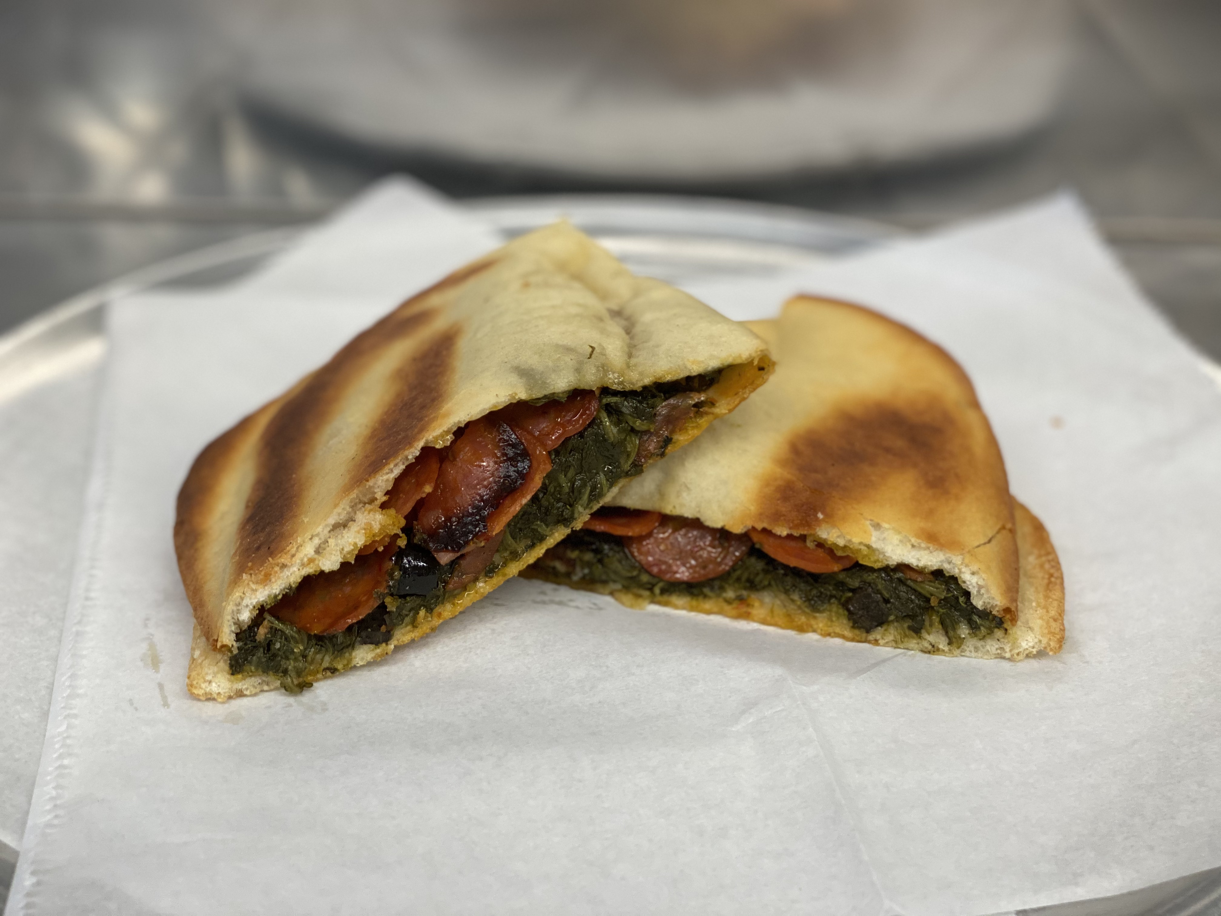 Order Spinach Pie with Pepperoni food online from Caserta Pizzeria store, Providence on bringmethat.com