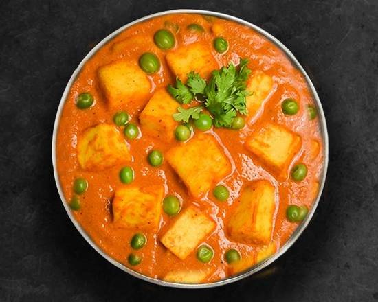 Order Pea & Cottage Cheese Curry food online from United Kitchens Of India store, Atlanta on bringmethat.com