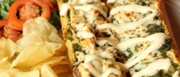 Order Pesto Chicken Sandwich food online from Palio's Pizza store, Coppell on bringmethat.com