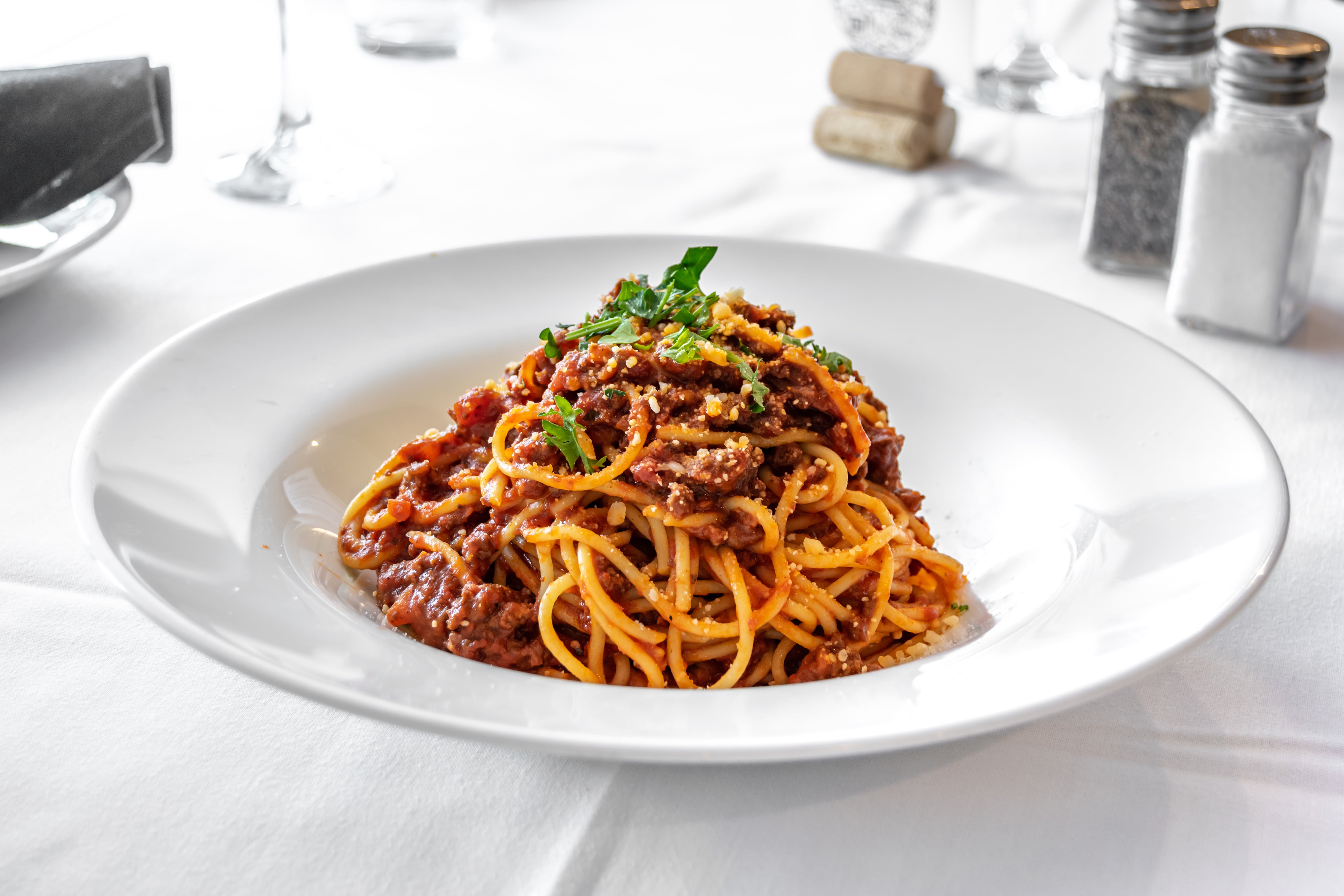 Order Spaghetti Bolognese - Pasta food online from Portofino's Restaurant store, Morristown on bringmethat.com