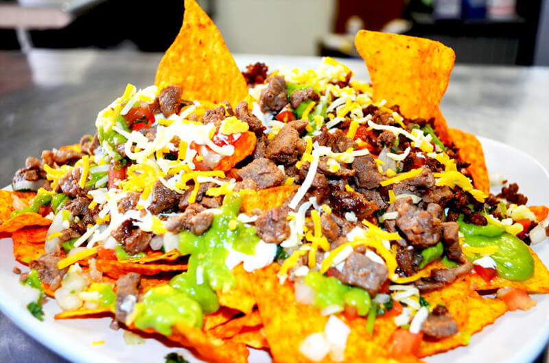 Order Super Nachos food online from D'Leon's Mexican Food store, Lincoln on bringmethat.com