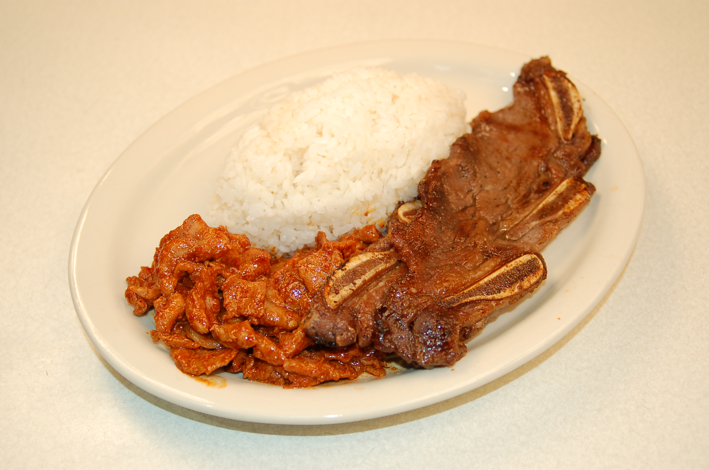 Order Spicy Pork & Kal-Bee Combo Plate food online from Bulgogi Korean Bbq store, Bellevue on bringmethat.com