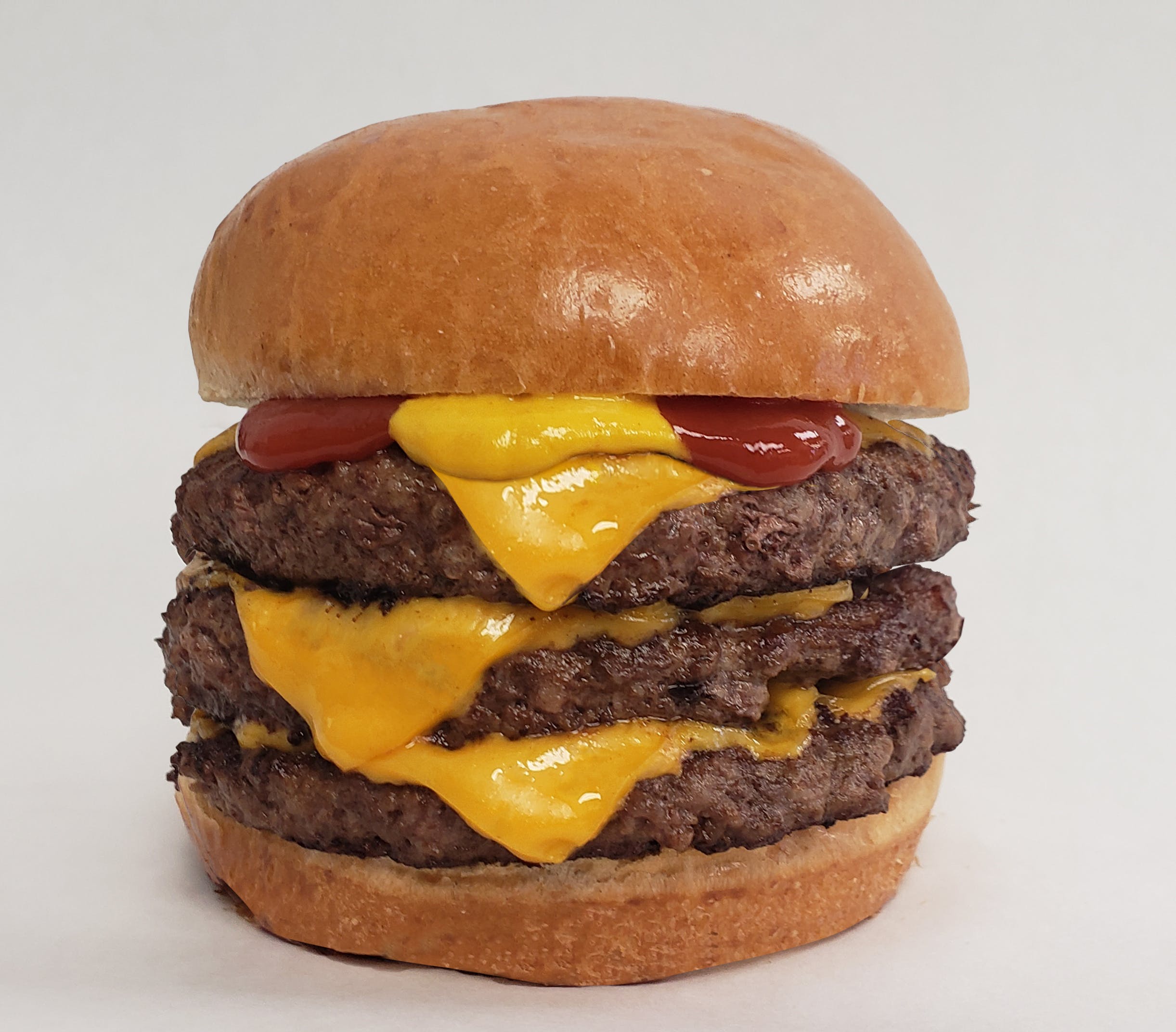 Order Triple Cheeseburger - Burger food online from Chubbys Cheesesteaks store, Milwaukee on bringmethat.com