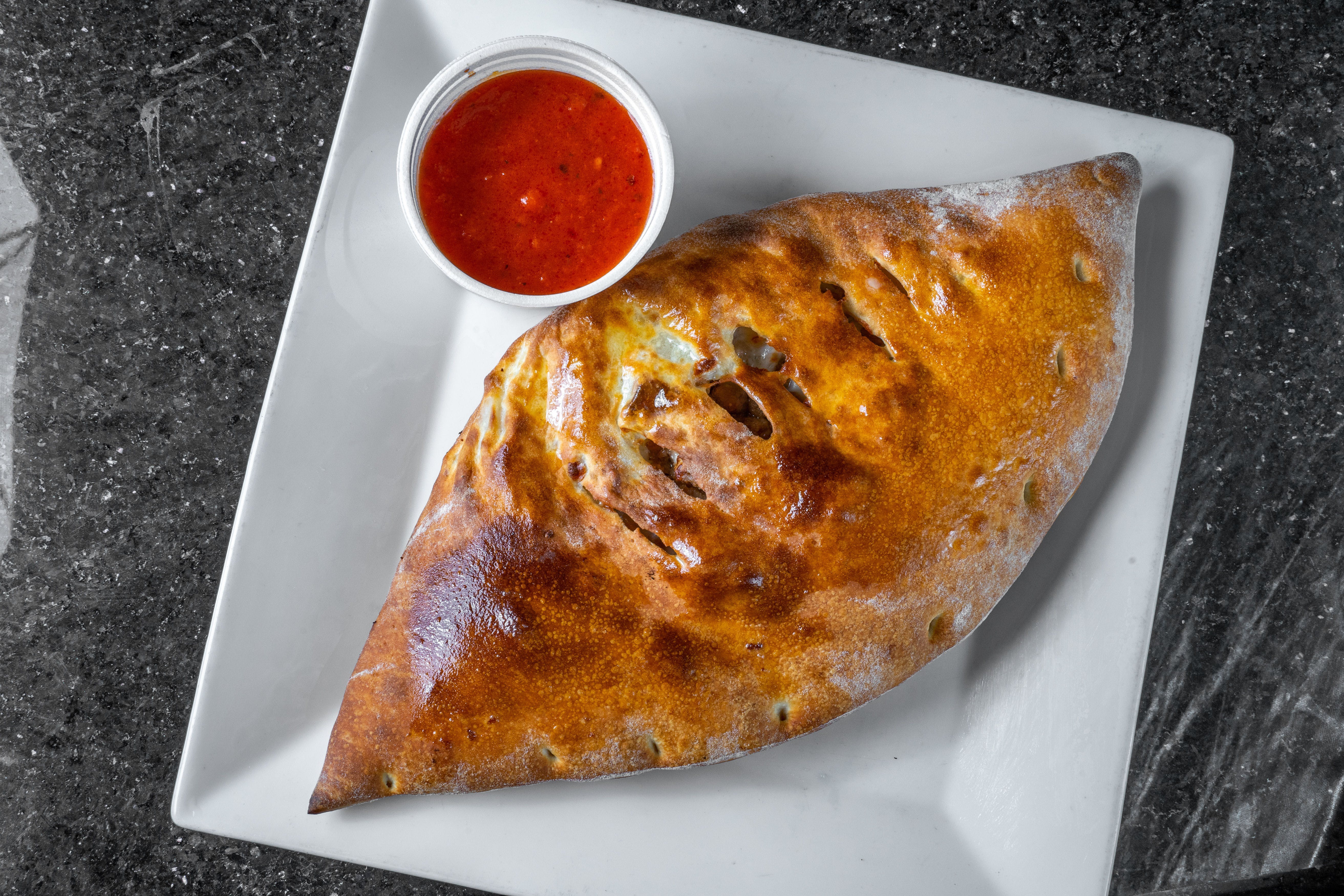Order Chicken Calzone - Calzone food online from My Pizzeria store, Fort Worth on bringmethat.com