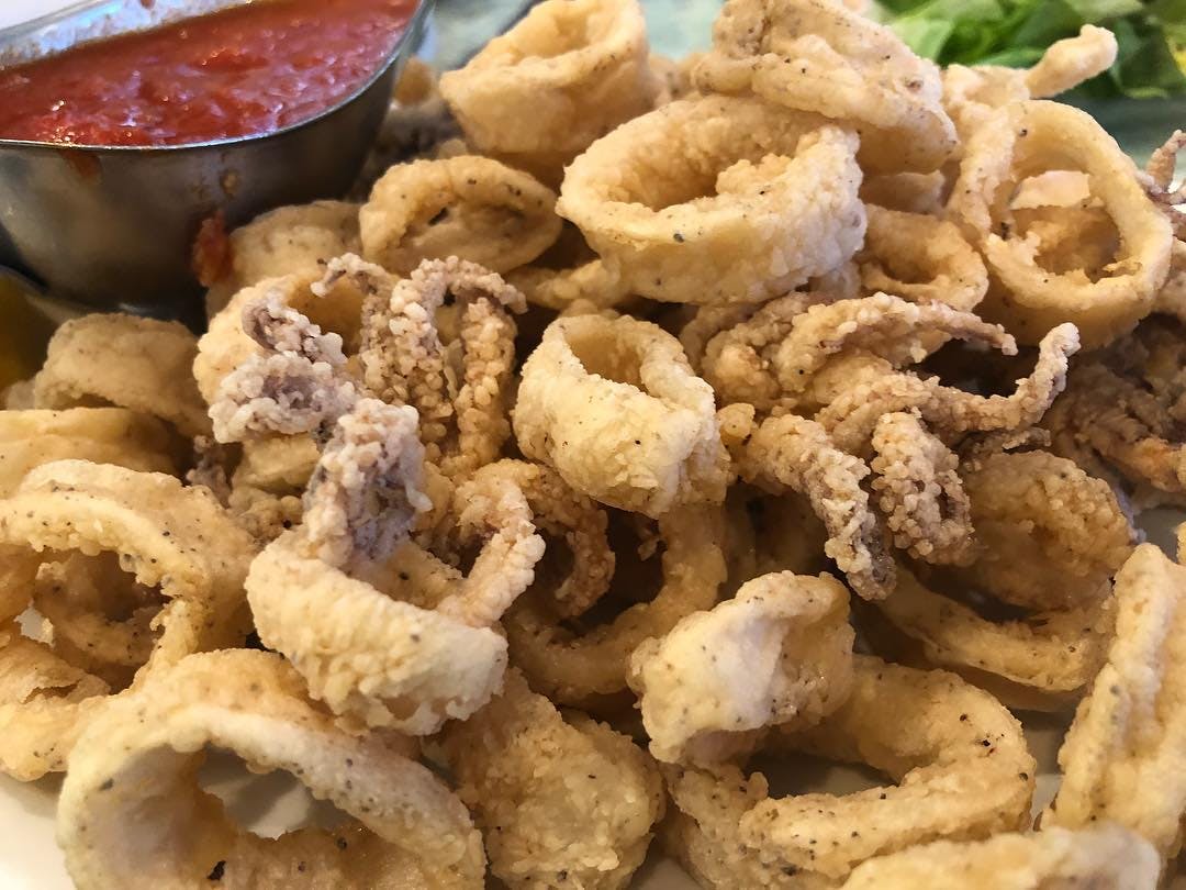 Order Fried Calamari - Large food online from Sinapi Pizzeria store, Brewster on bringmethat.com