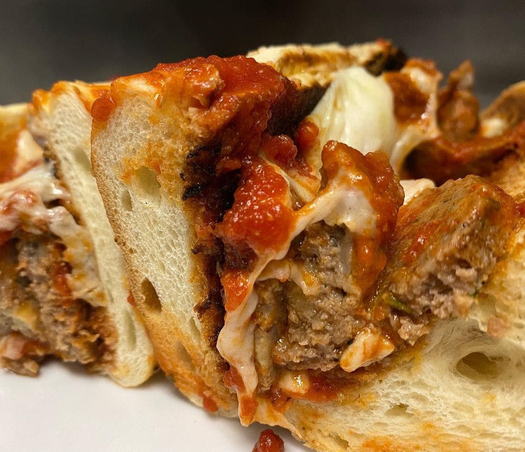 Order Meatball Parmigiana Hero - Heros food online from Red Volpe Pizzeria Ristorante store, Bethpage on bringmethat.com