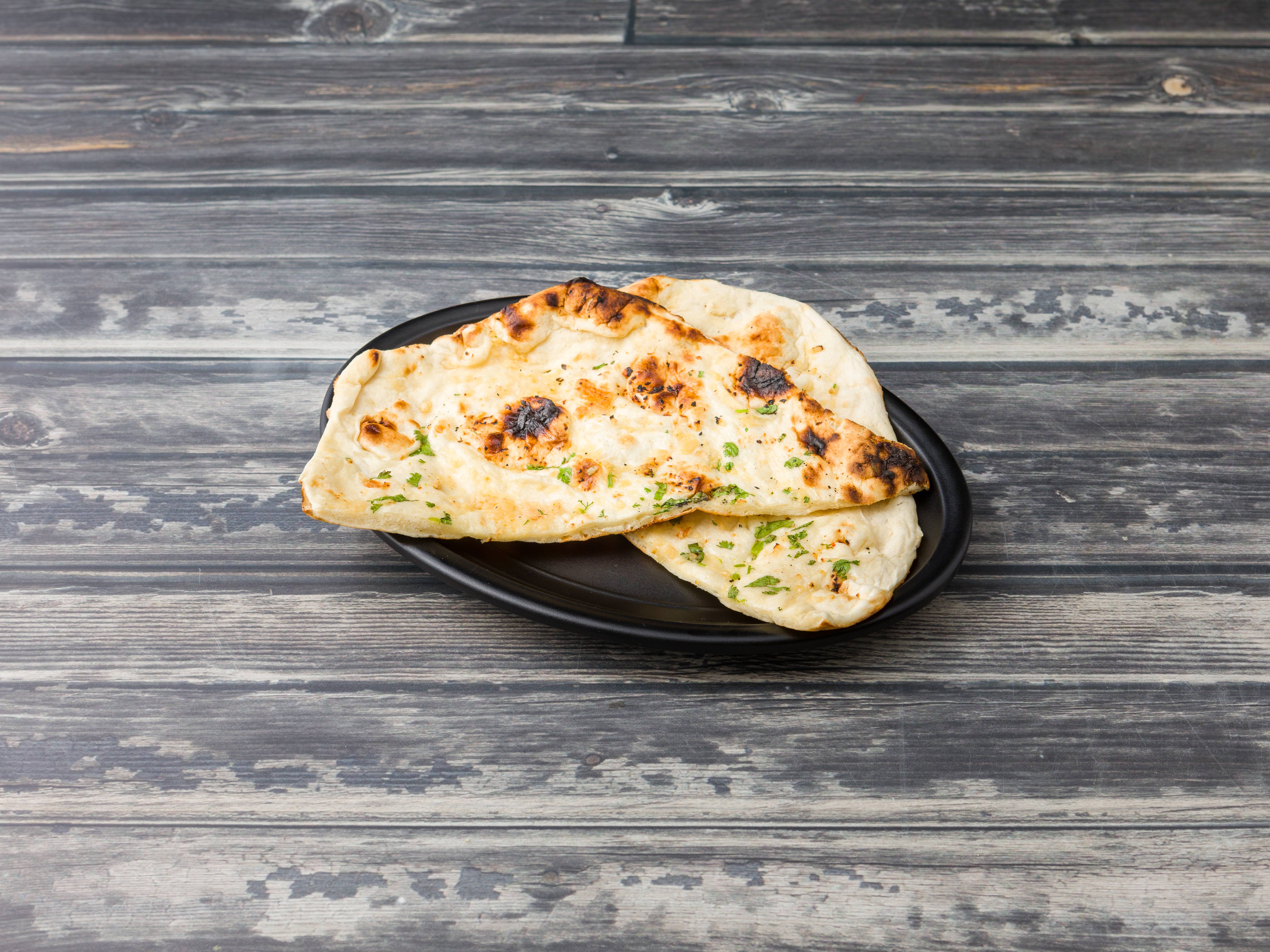 Order Garlic Naan food online from Chaska Fine Indian Cuisine store, Jersey City on bringmethat.com