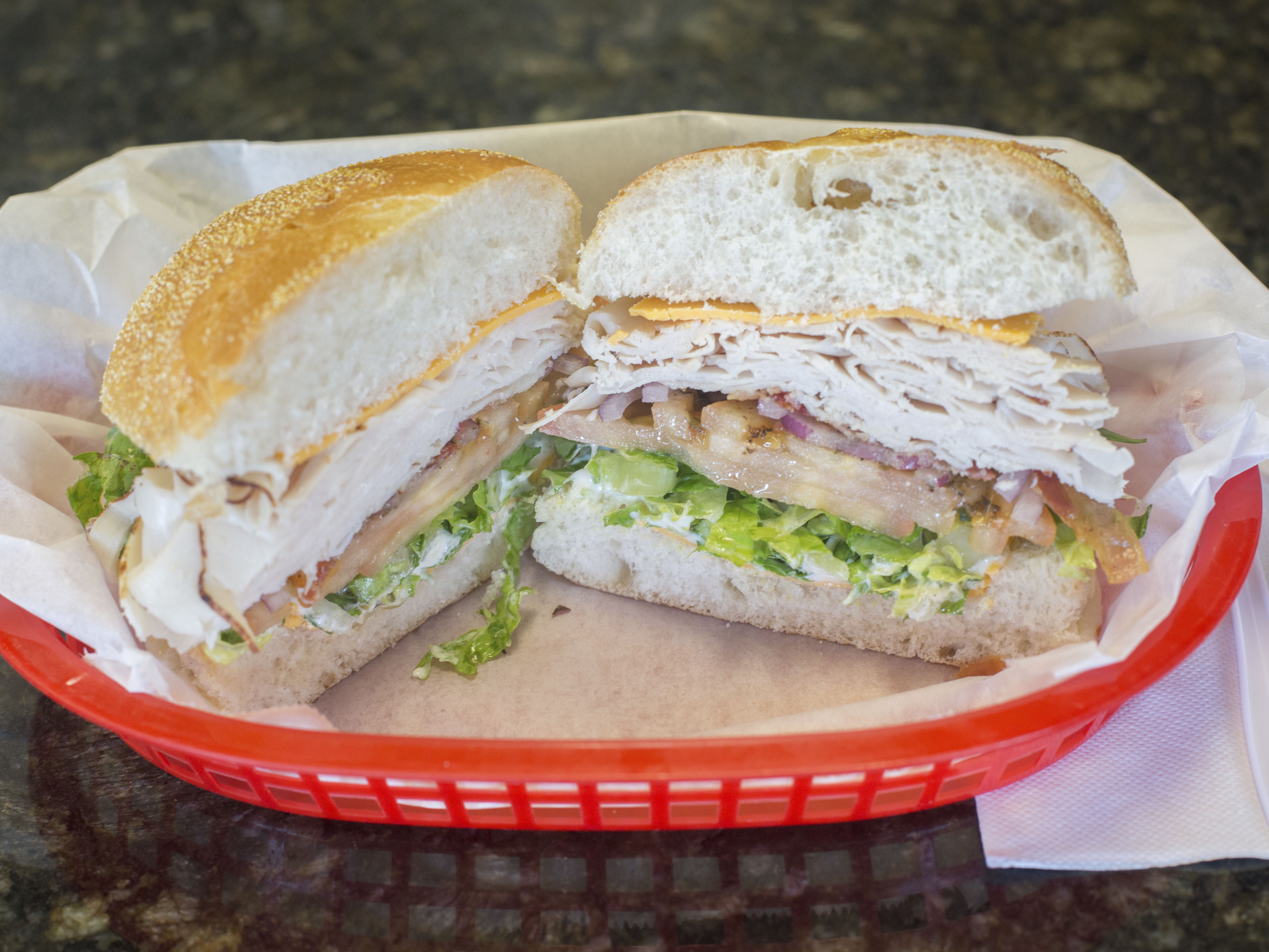 Order Turkey Club Sandwich Deluxe food online from Harveys Café And Market store, West Hartford on bringmethat.com