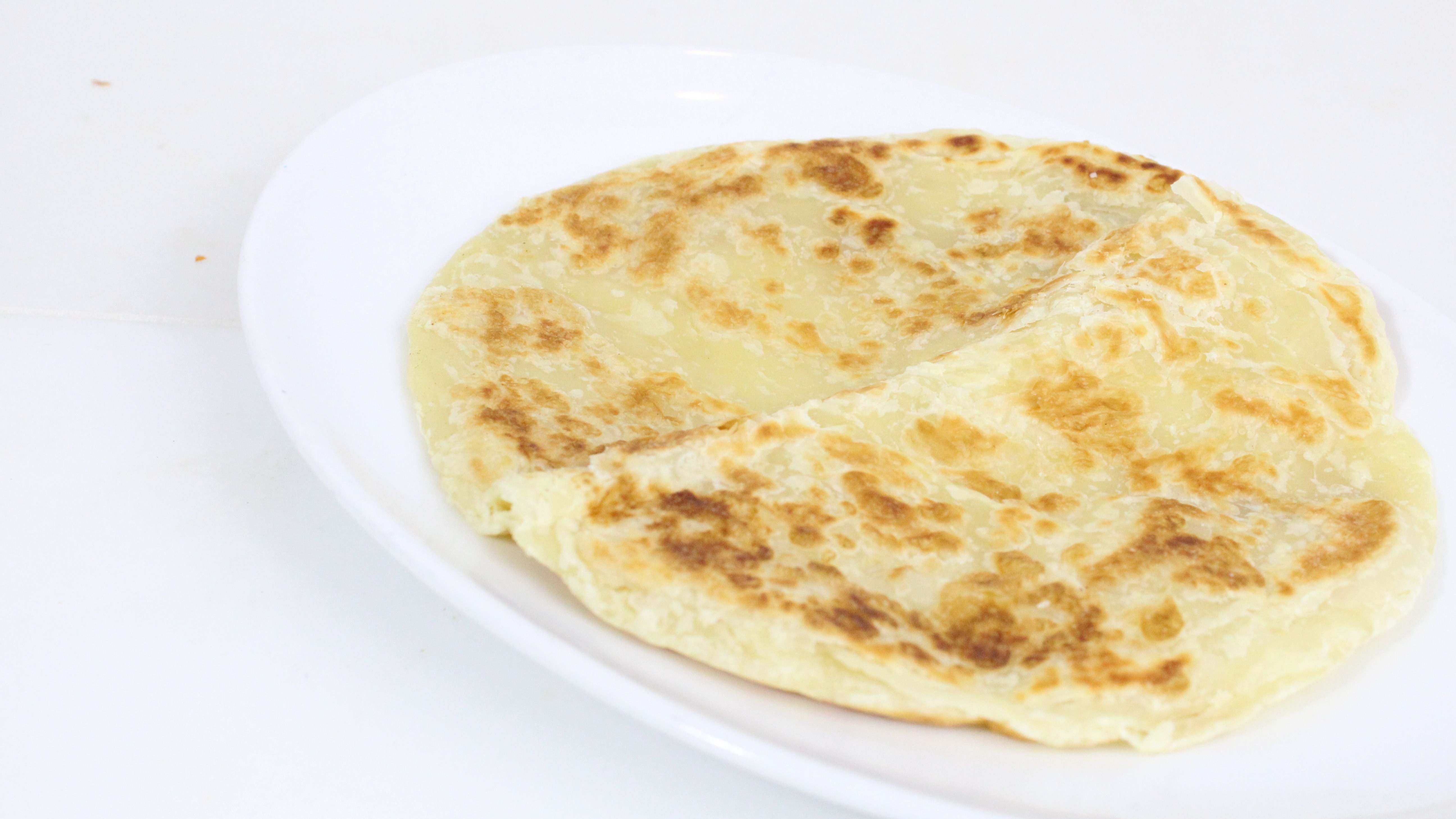 Order Malaysian Paratha food online from Inchin Bamboo Garden store, Irvine on bringmethat.com