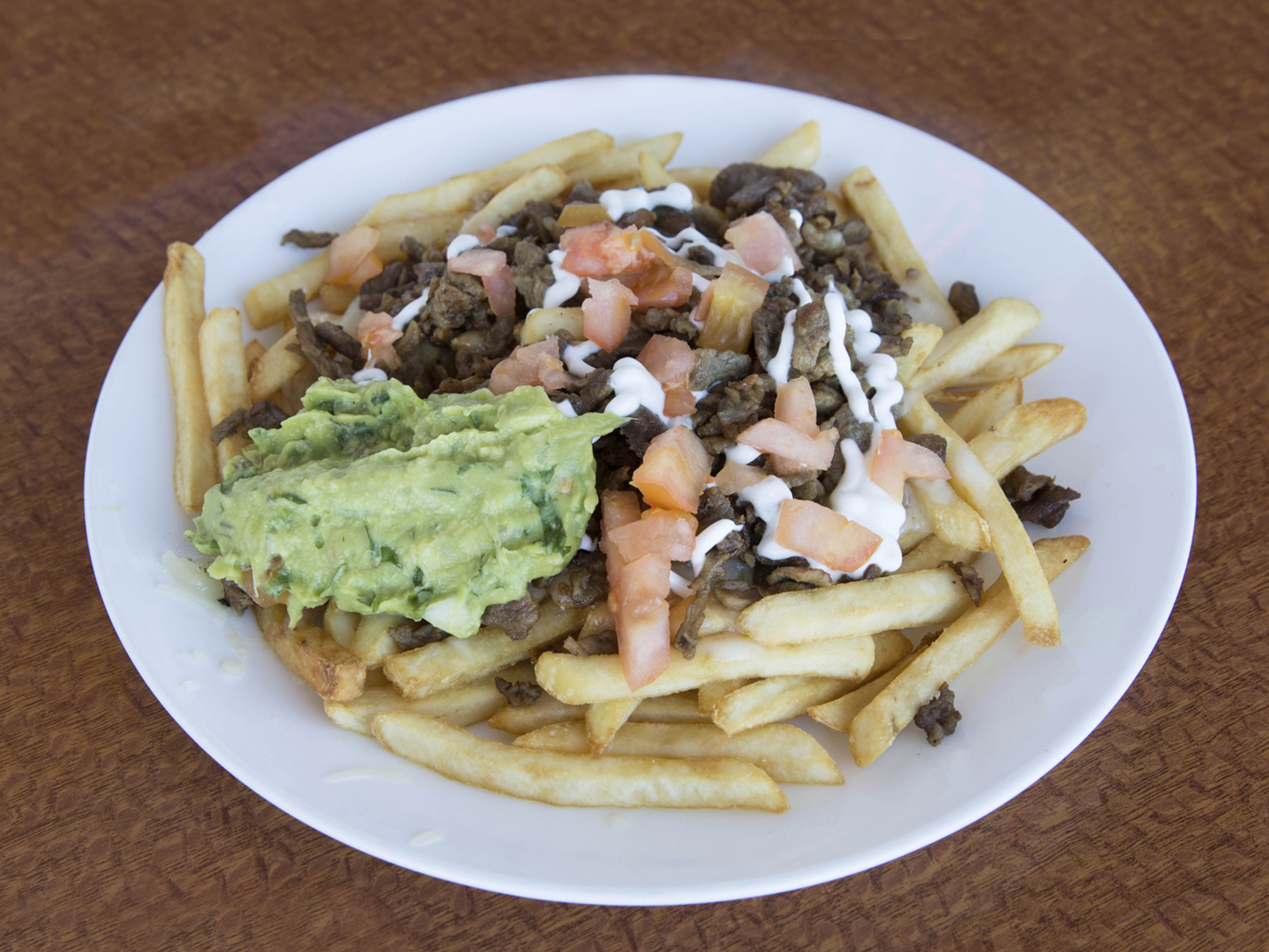 Order 4. Asada Fries food online from Taqueria Guerrero Style store, Westminster on bringmethat.com