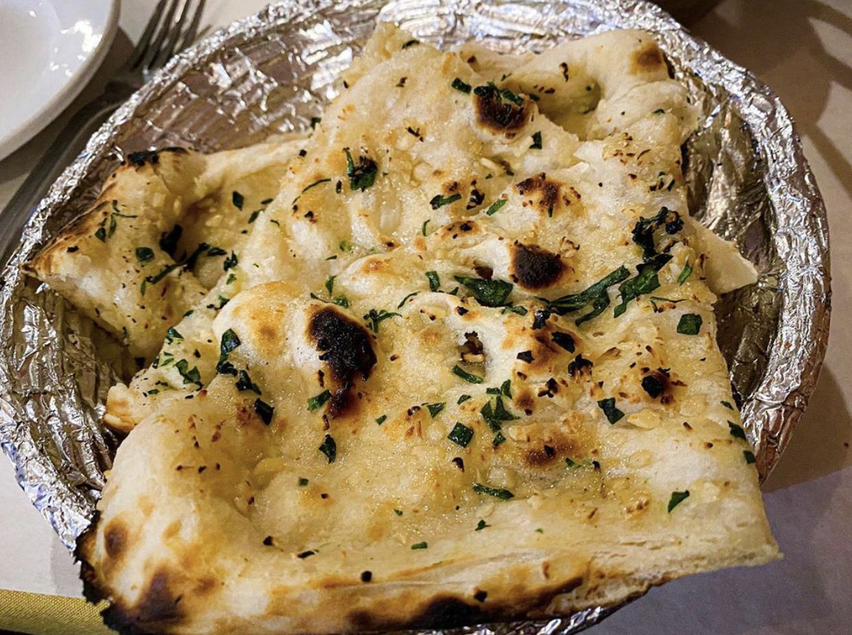 Order Garlic Naan food online from Star of India Restaurant store, Little Rock on bringmethat.com