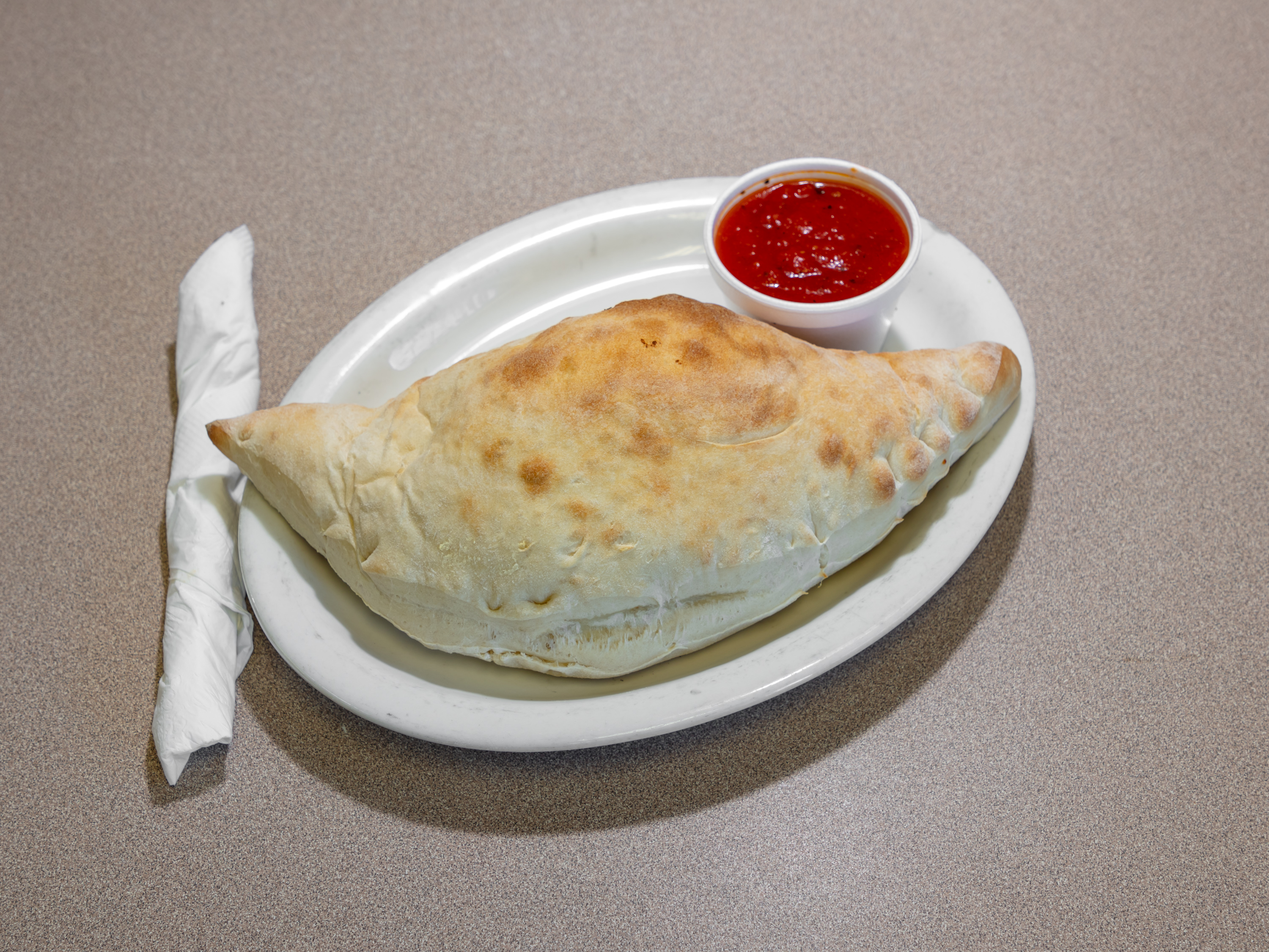 Order Calzone food online from Goodfellas Pizza & Subs store, Wylie on bringmethat.com