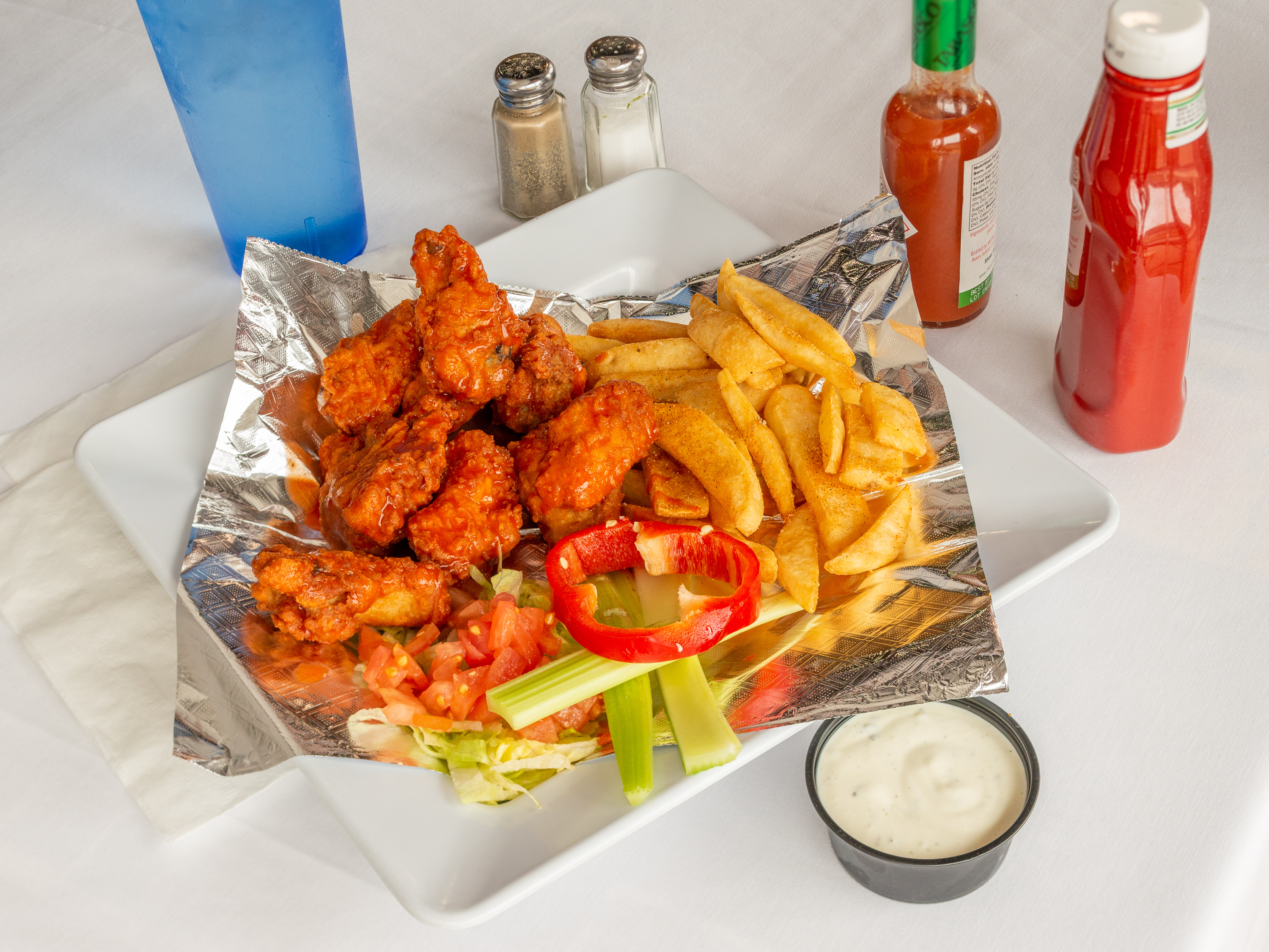 Order 7 Buffalo Wings with French Fries food online from Good Day Cafe store, Arlington on bringmethat.com
