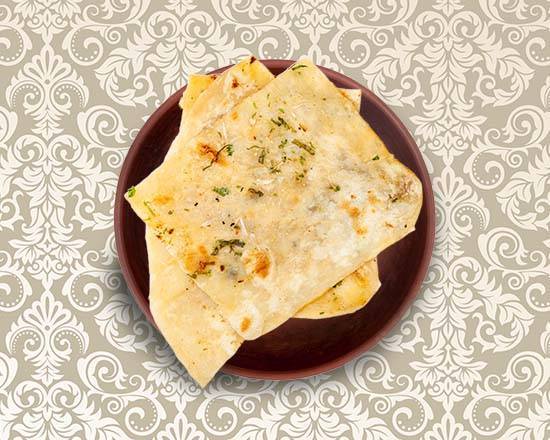 Order Garlic Naan food online from Eternal Clay Pot store, Fort Collins on bringmethat.com