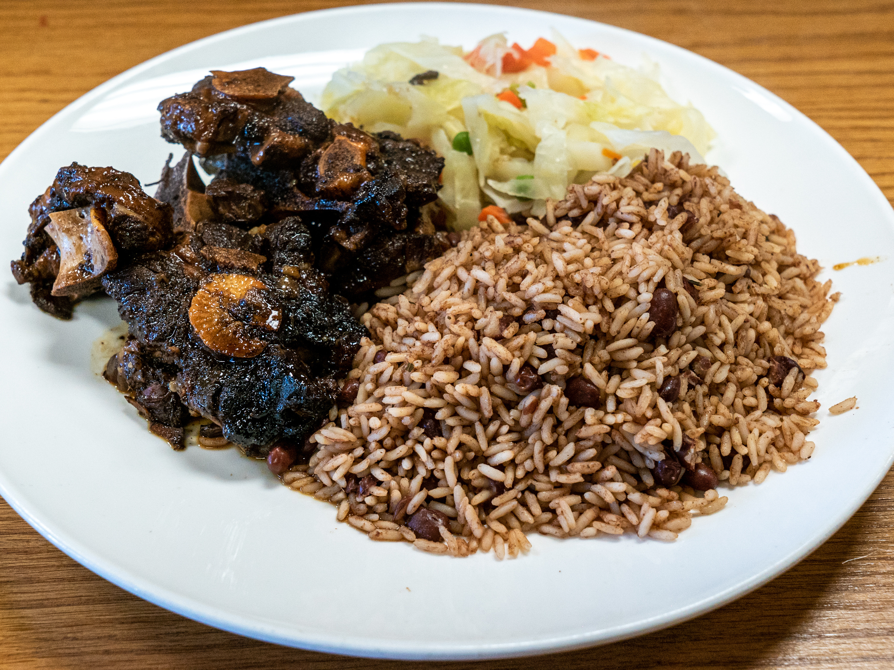 Order Oxtail meat only food online from Hartman Jerk Center store, Wilkes Barre on bringmethat.com
