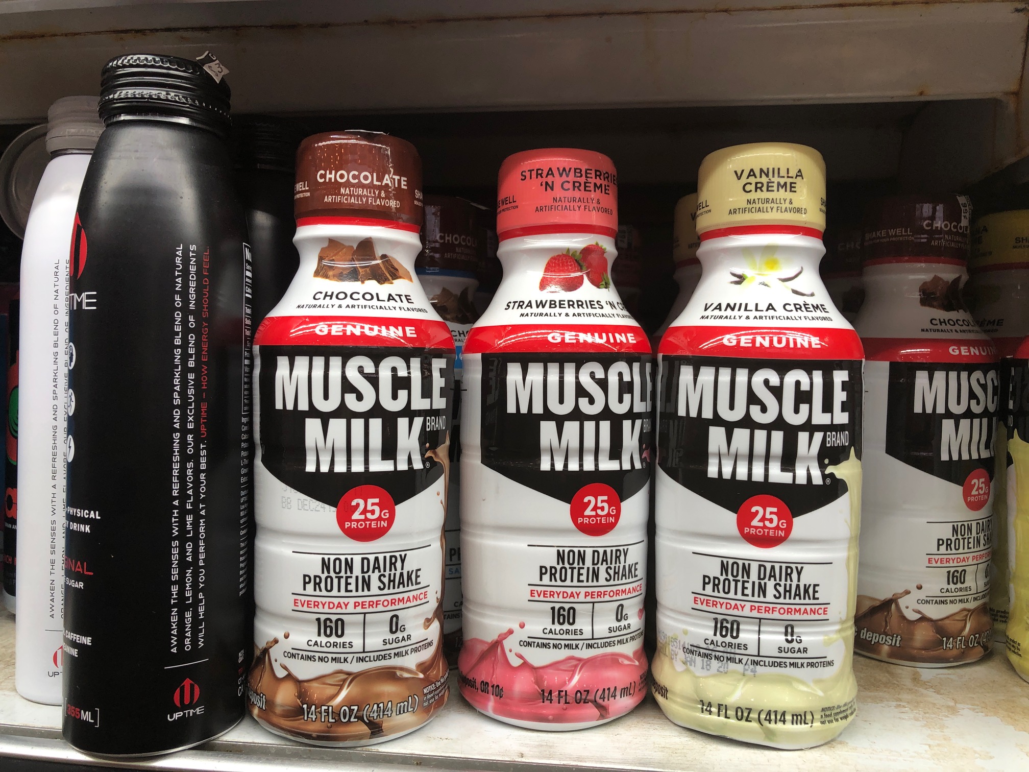 Order 14 oz. Muscle Milk food online from 5 brothers gourmet deli store, New York on bringmethat.com