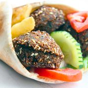 Order 14. Falafel Deluxe Sandwich  food online from Wally's Falafel and Hummus store, Minneapolis on bringmethat.com