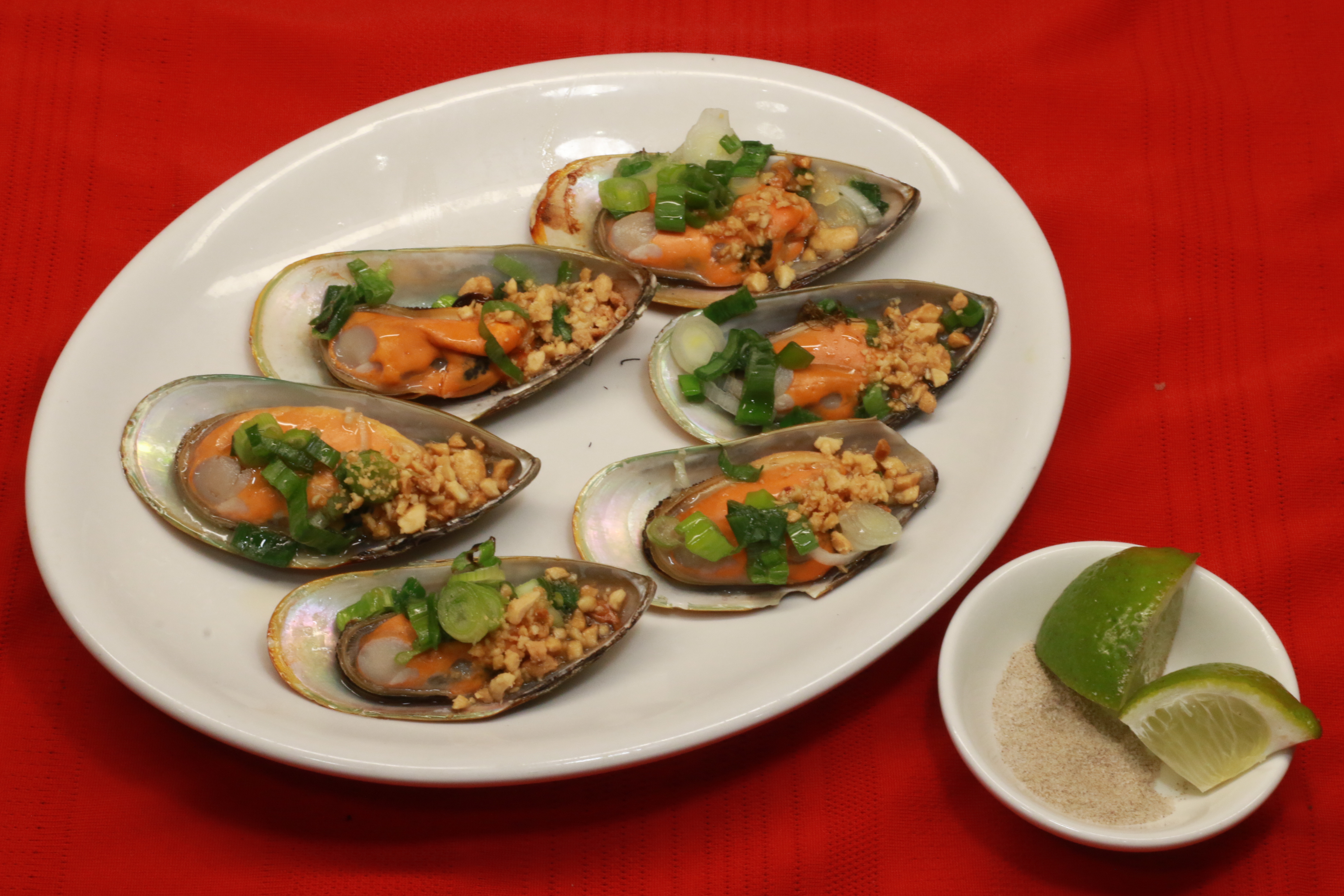 Order A15. Grilled Green Mussels (7) food online from Pho Khang store, Englewood on bringmethat.com