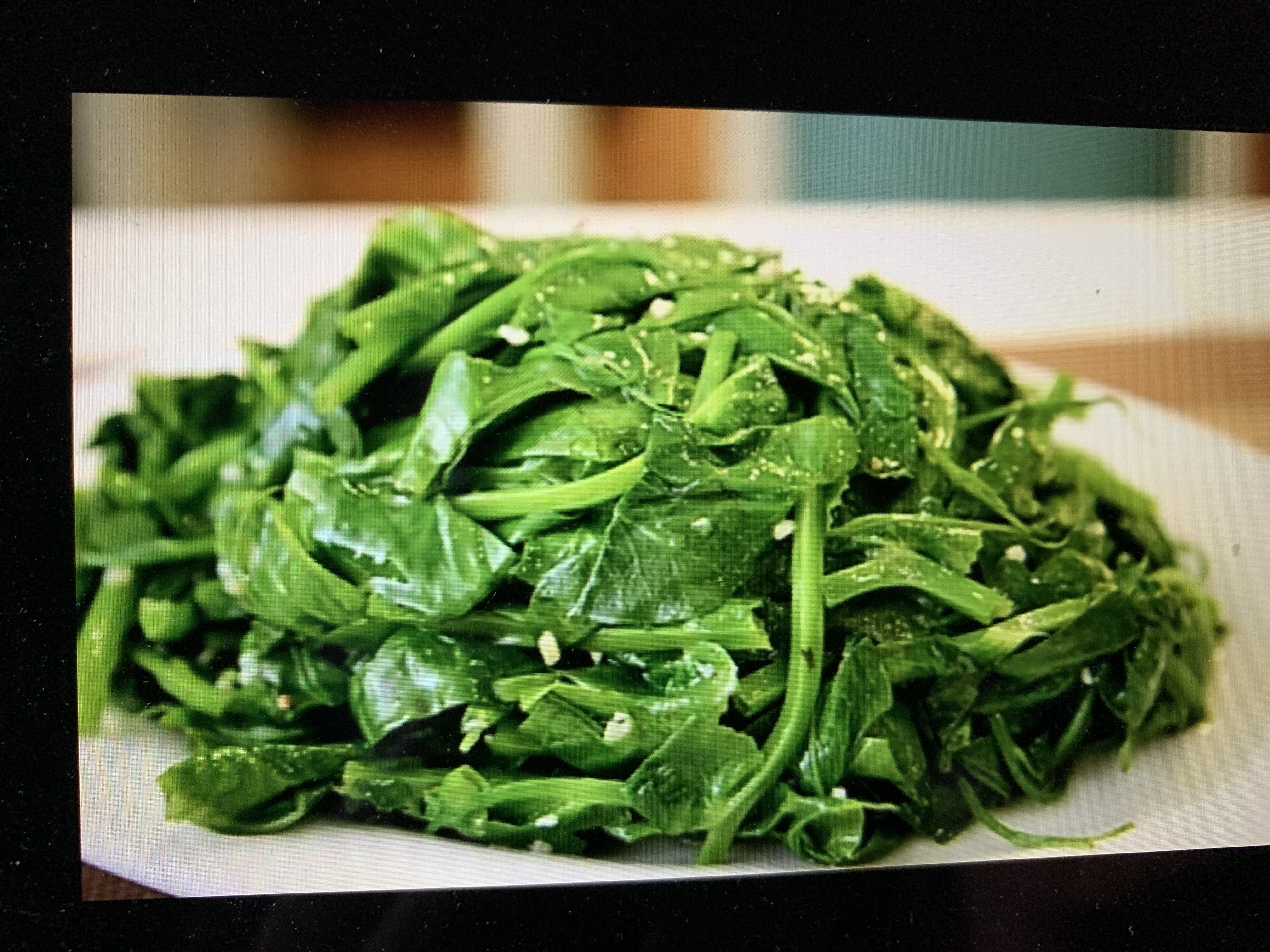 Order 蒜茸大豆苗 Garlic Pea Shoots food online from Dumpling Empire store, South San Francisco on bringmethat.com