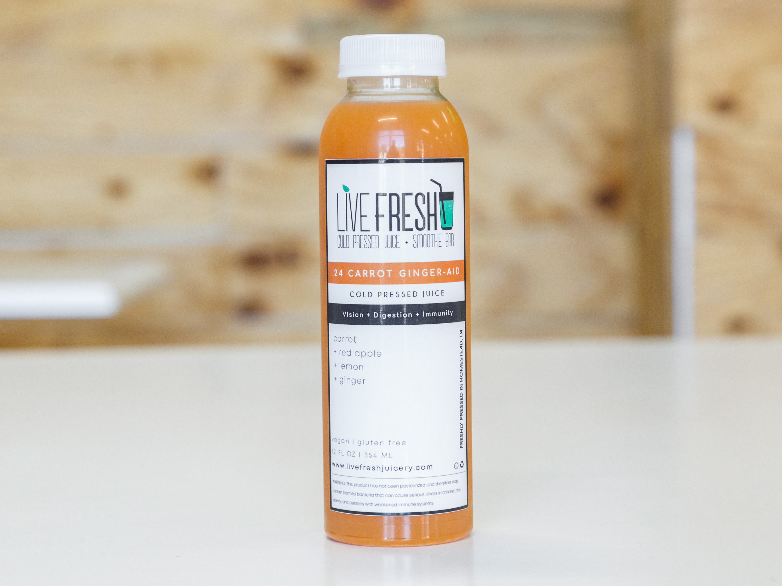 Order 24 Carrot Ginger Aid food online from Live Fresh Cold Pressed Juice & Smoothie Bar store, Homestead on bringmethat.com