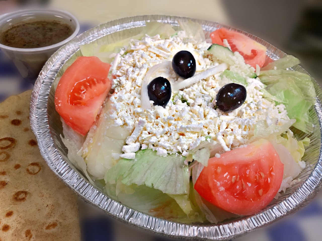 Order Greek Salad food online from Village Pizza & Seafood store, Santa Fe on bringmethat.com