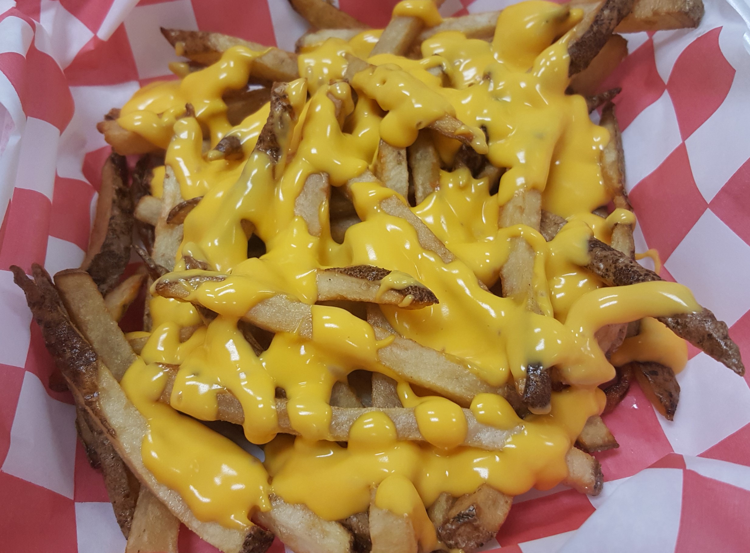 Order CHEESY FRIES food online from Carnival Cafe store, Owensboro on bringmethat.com