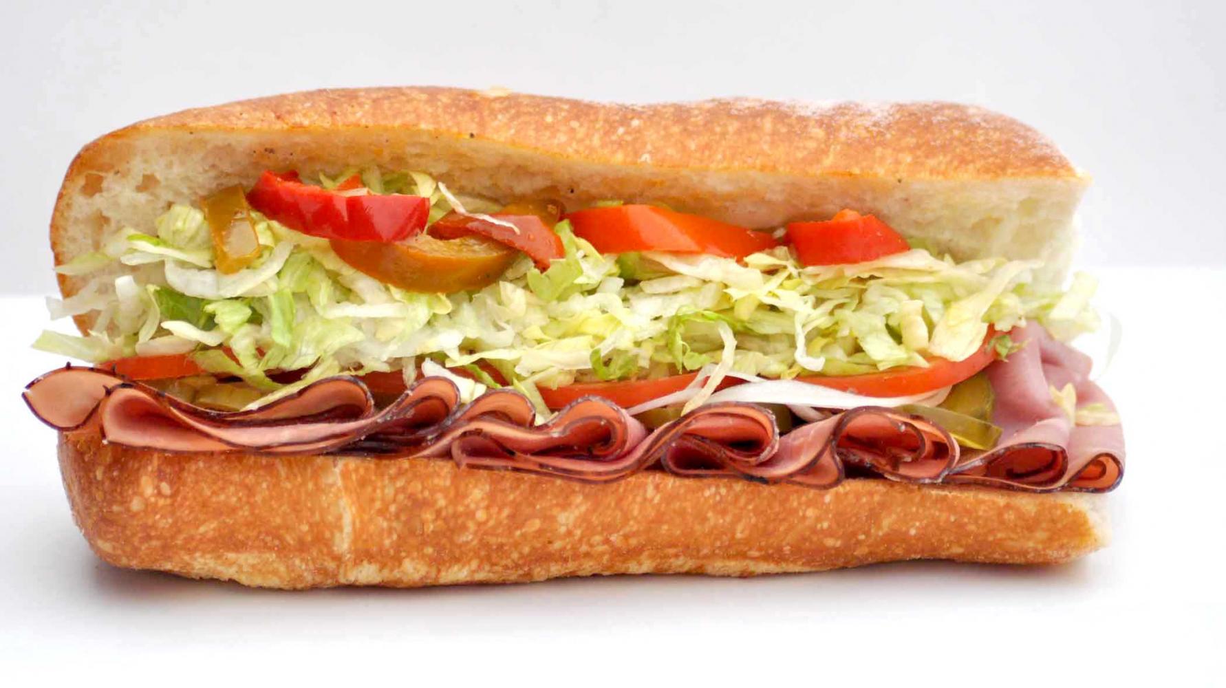 Order Smoked Turkey Sandwich food online from Cafe Deli-Cious store, New York on bringmethat.com