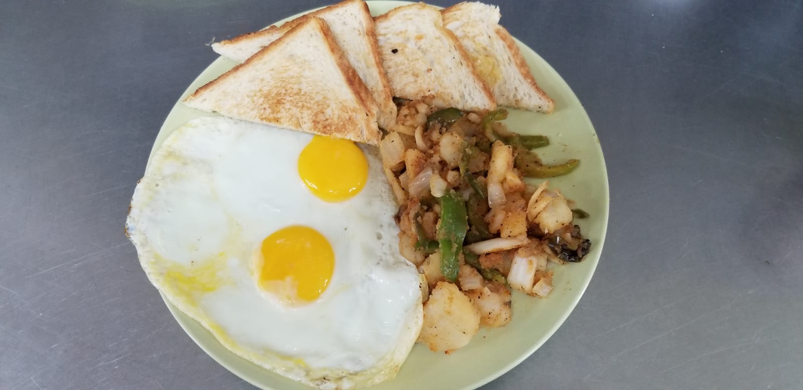 Order Two eggs any style with home fries and toast food online from Aminas Cafe store, Bronx on bringmethat.com