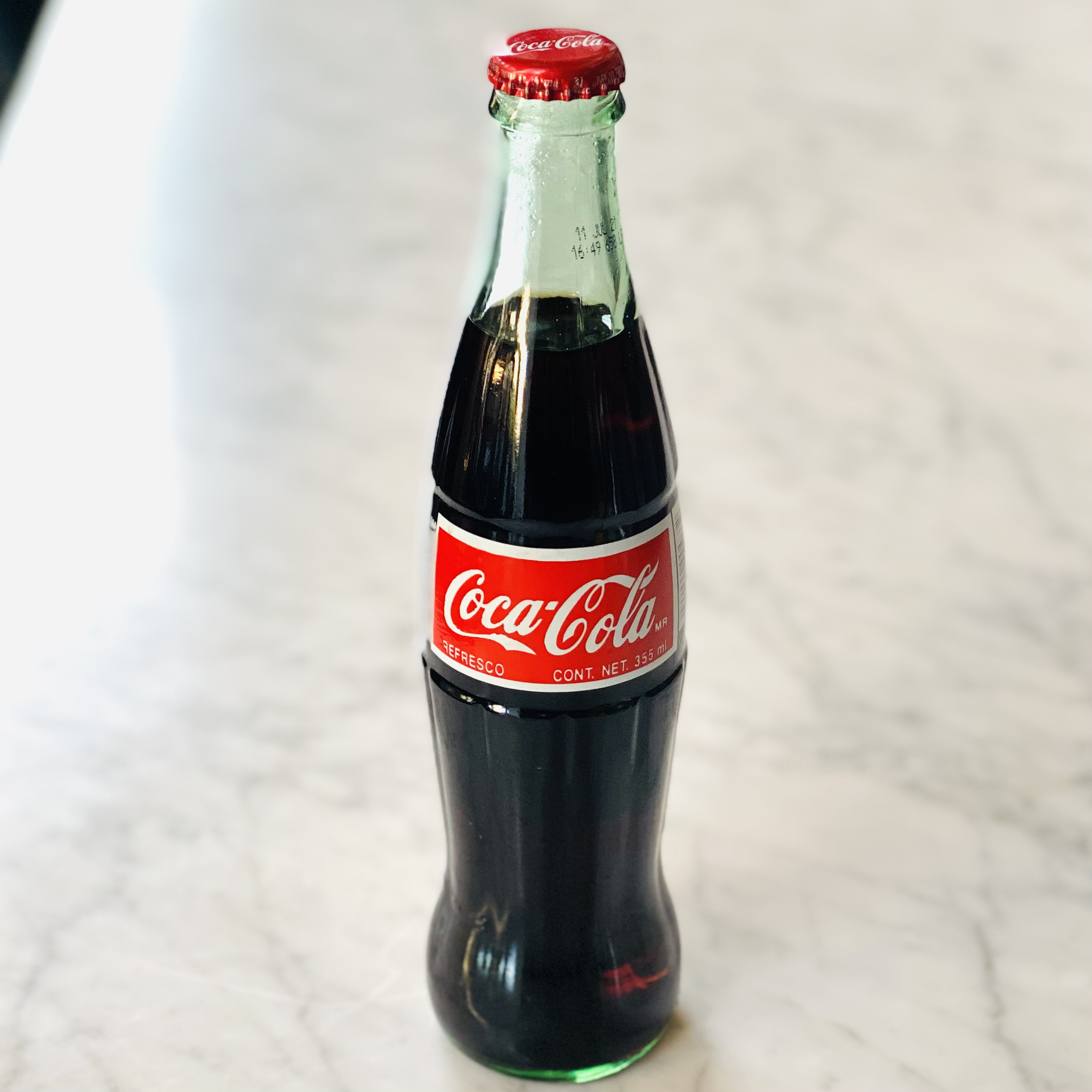 Order Mexican Coke 355ml food online from Rise Woodfire store, San Mateo on bringmethat.com