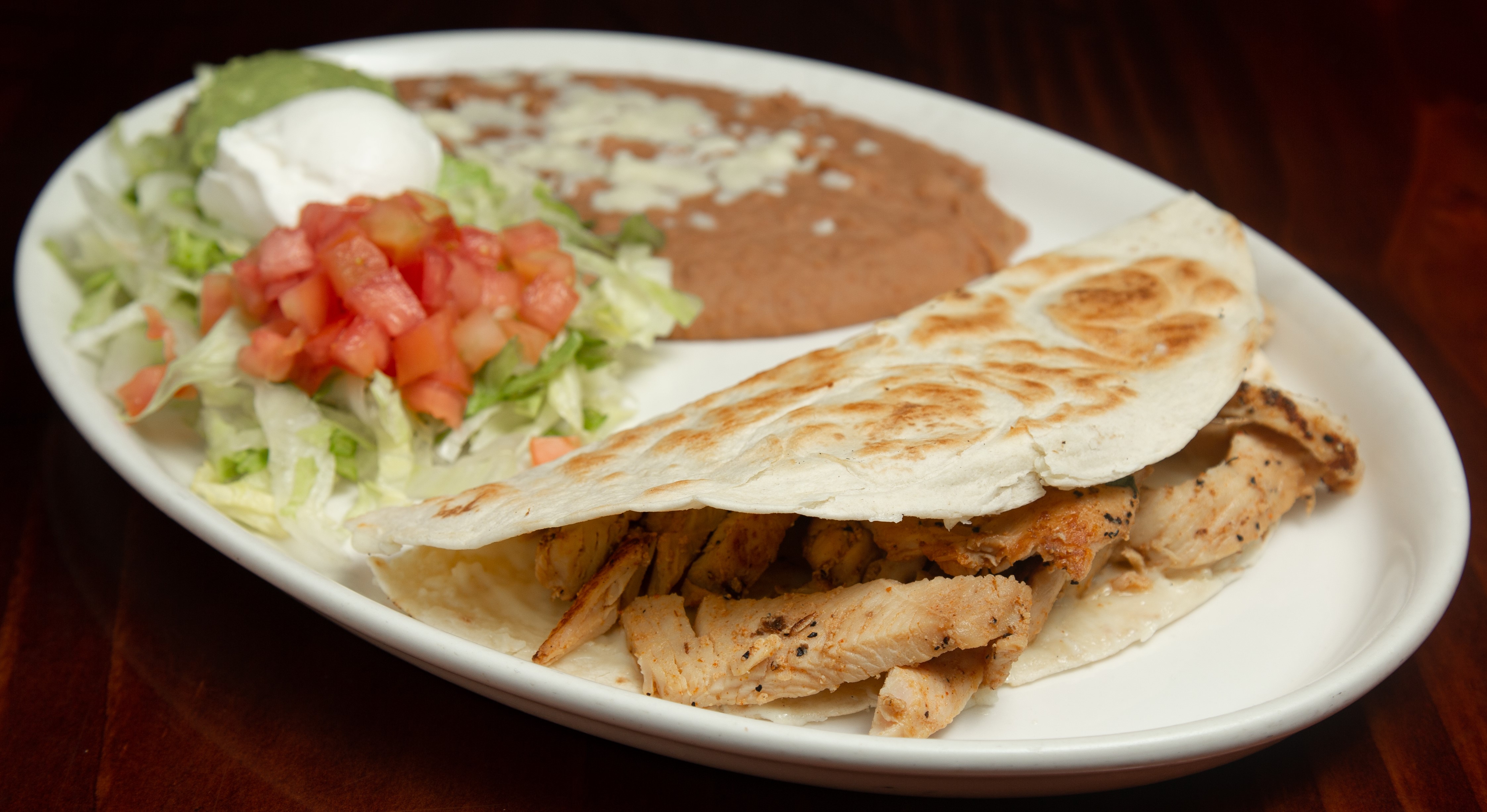 Order Tito's Quesadilla Dinner food online from Pueblo Real store, Franklin on bringmethat.com