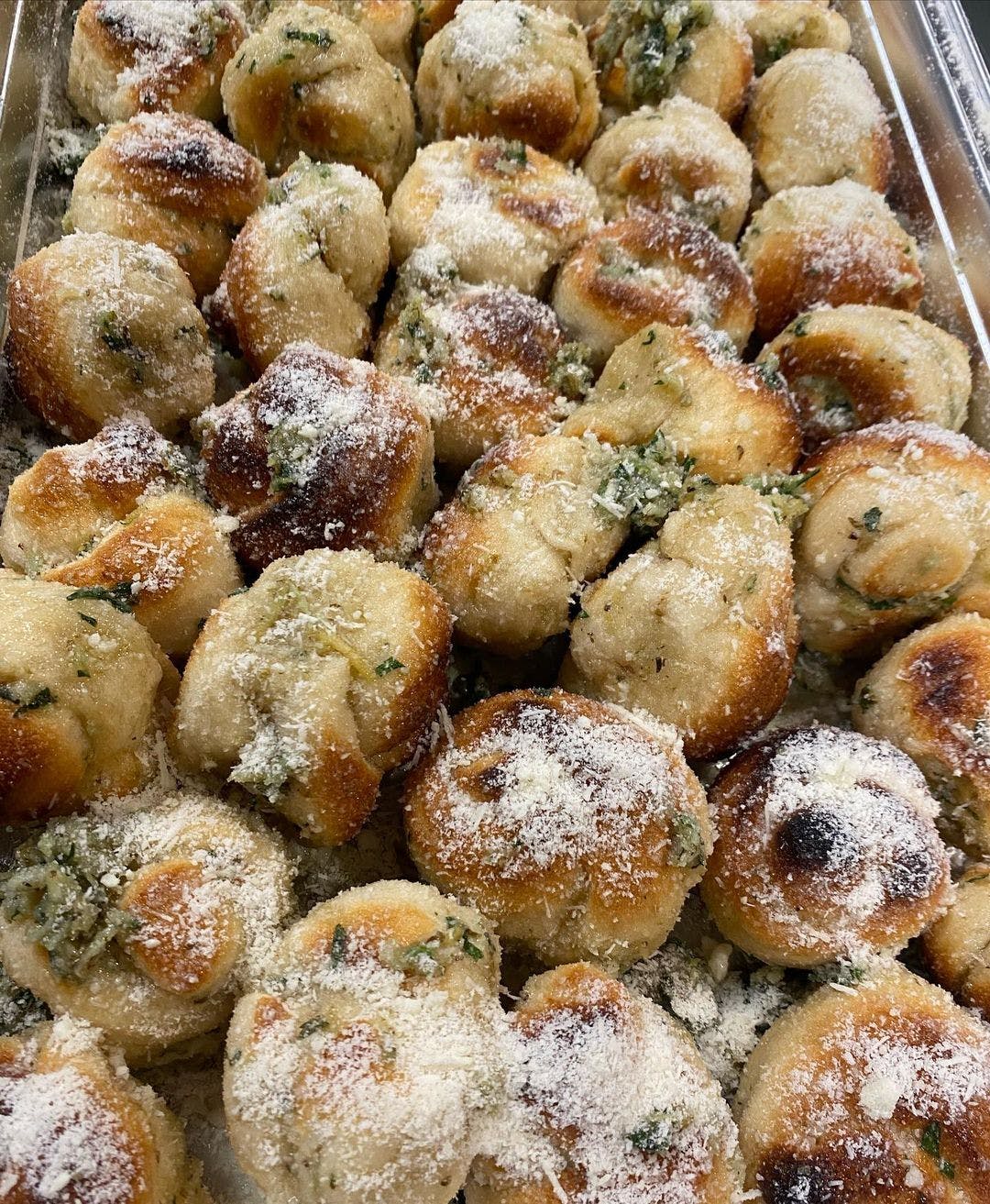 Order Garlic Knots - 6 Pieces food online from Red Volpe Pizzeria Ristorante store, Bethpage on bringmethat.com